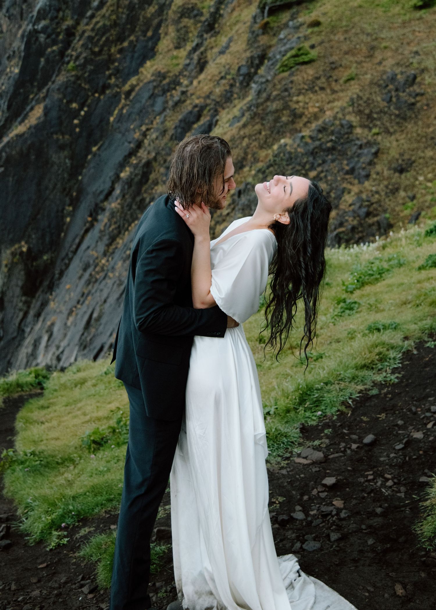 A tender embrace between newlyweds on a scenic mountain trail. Banff and Calgary Wedding Photographer