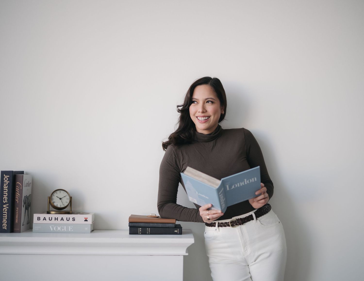 A series of six photos showing someone relaxing and reading a book in various cozy positions on a couch.