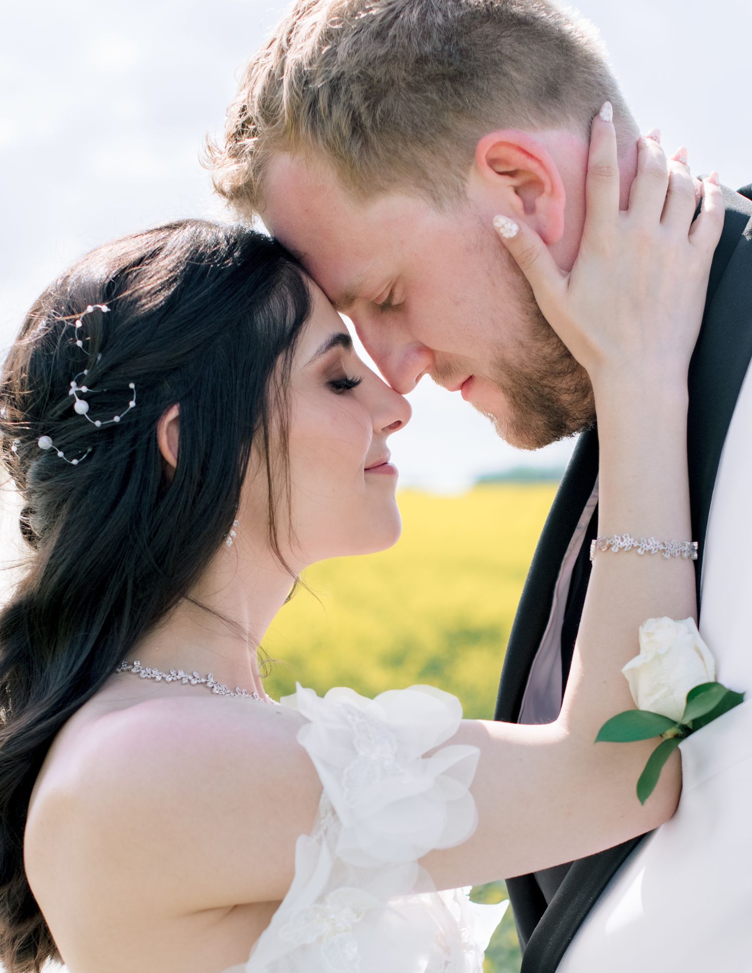 A romantic wedding photoshoot collection shows tender moments between the newlyweds against a bright outdoor backdrop.