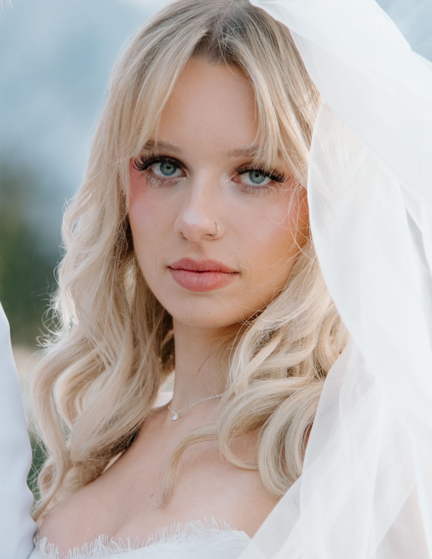 Romantic bridal portrait with soft lighting and flowing veil. Calgary Wedding Photographer
