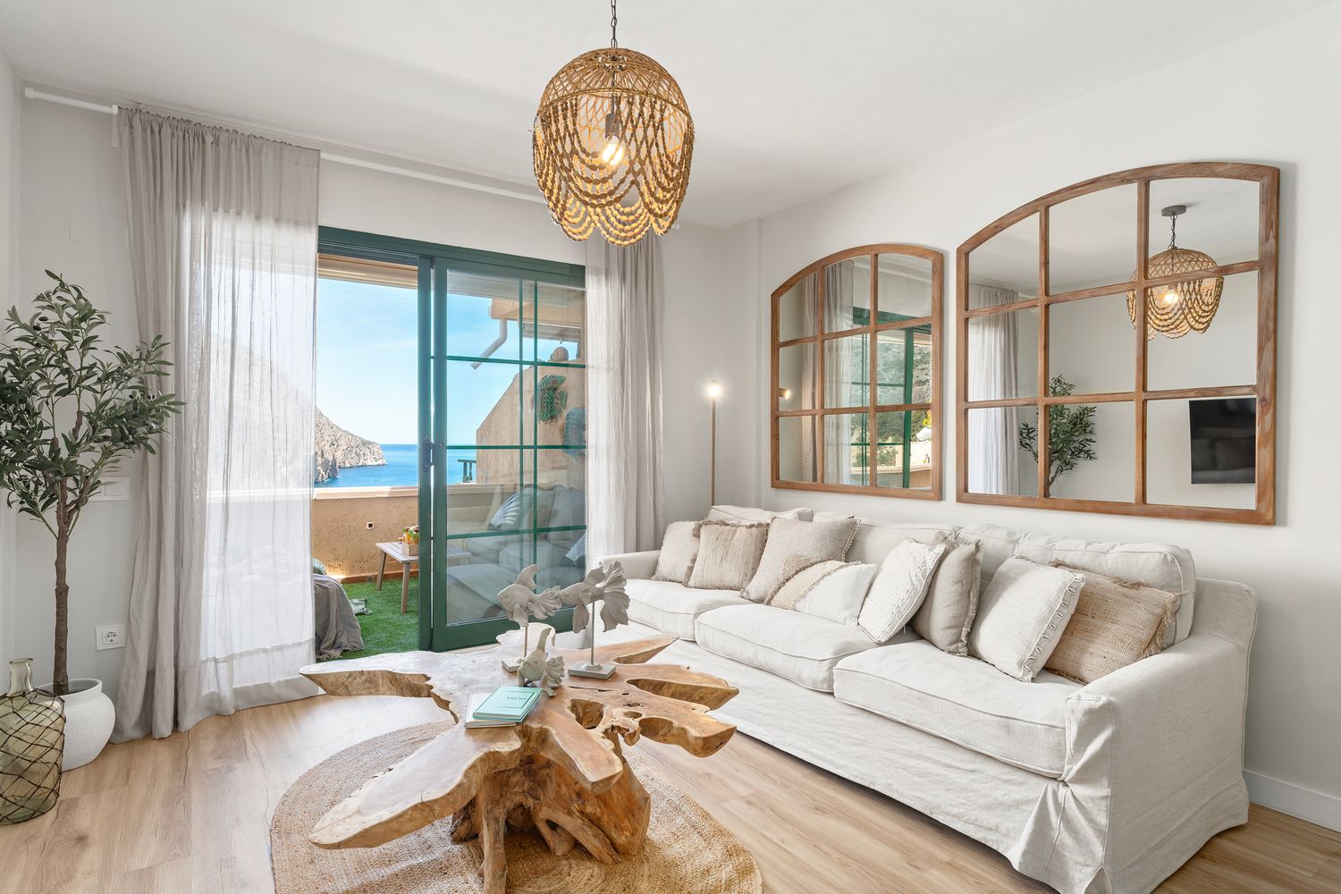 Airy living room in Altea with Mediterranean styling and large windows. Interior photography for modern rentals and coastal properties.
