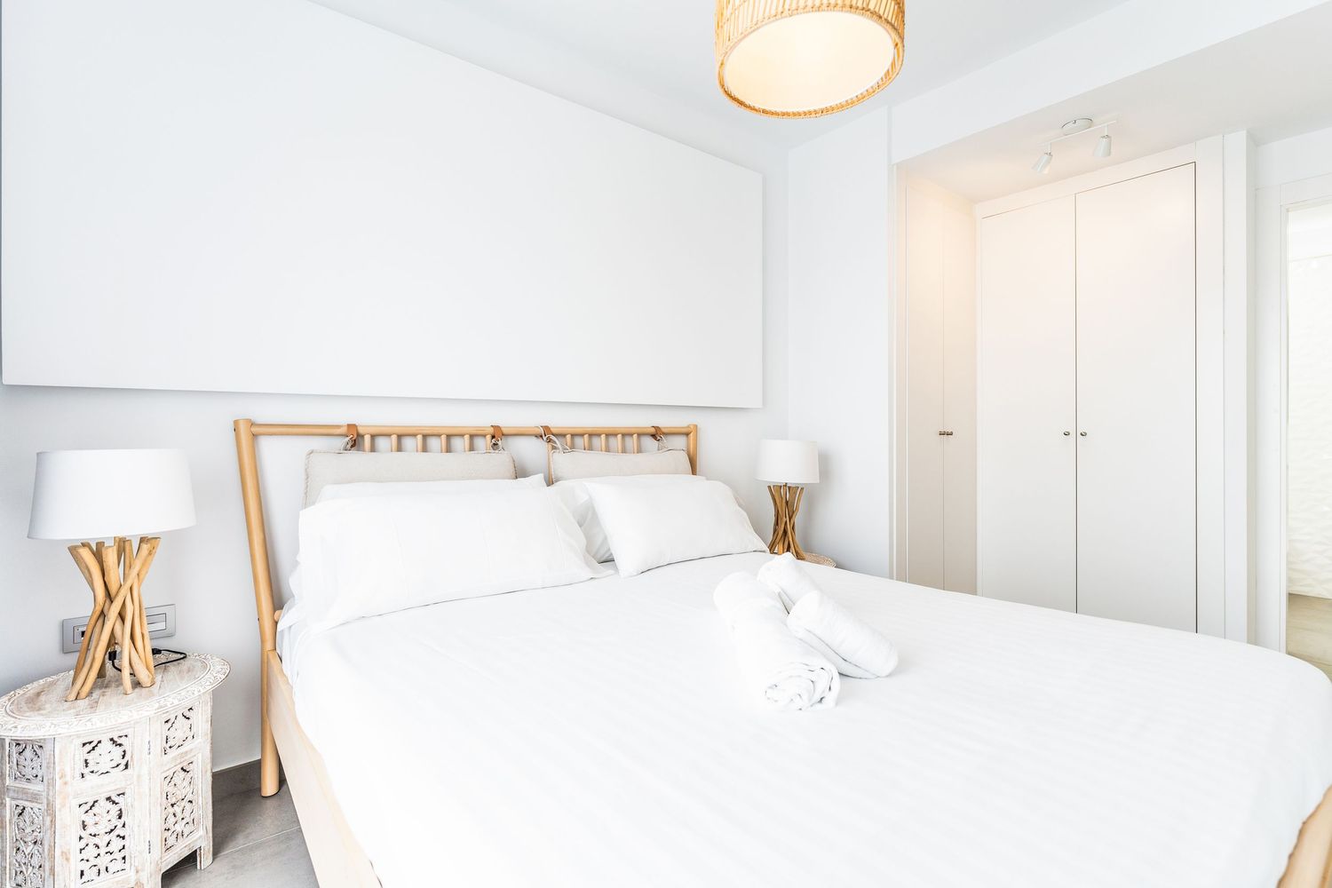 Bright Airbnb bedroom photographed in Alicante, Spain. Clean lines, natural light, and fresh interior styling for short-term rental listings