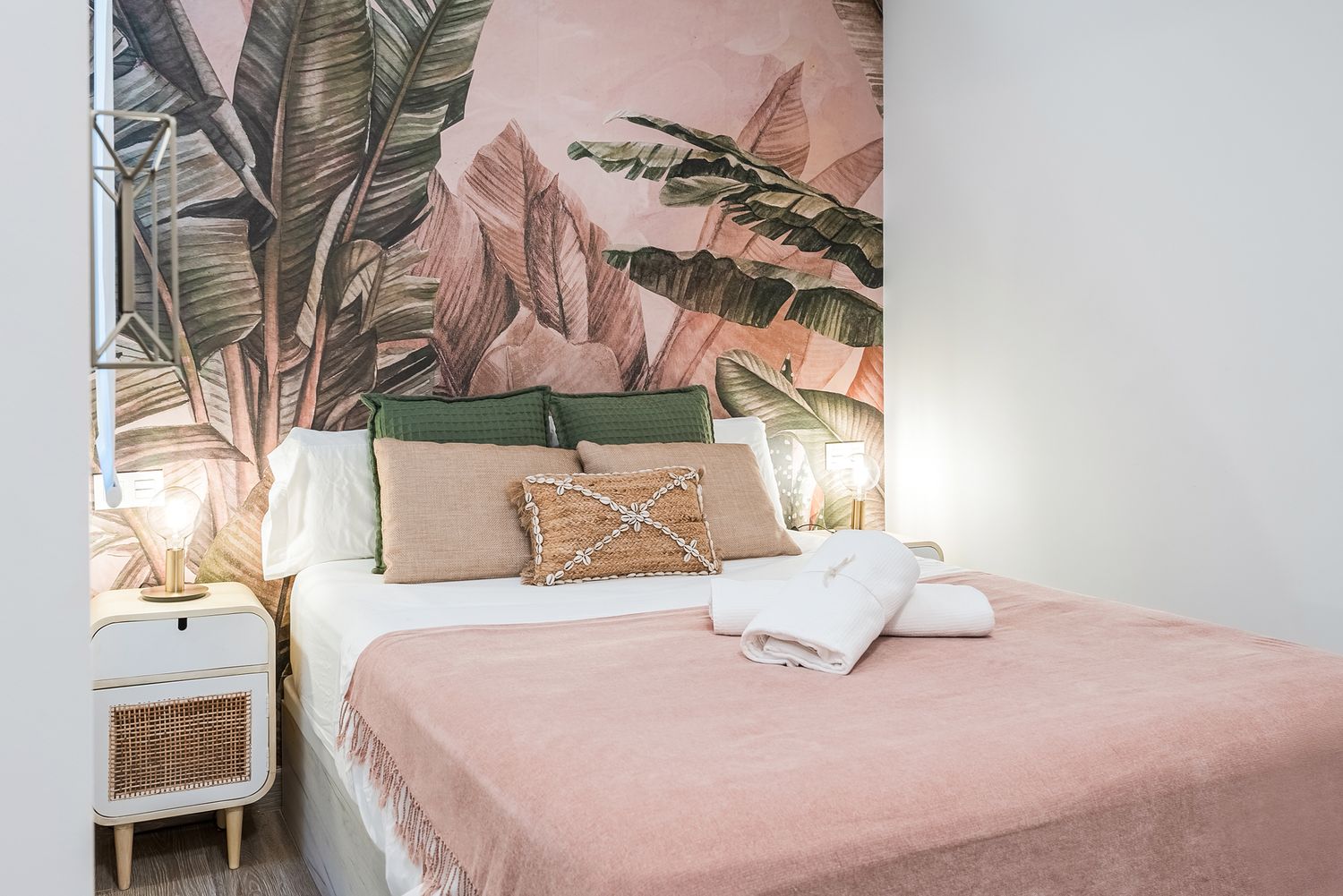 Beautifully styled bedroom with natural tones and warm lighting. Interior photography for rentals in Alicante, Spain.