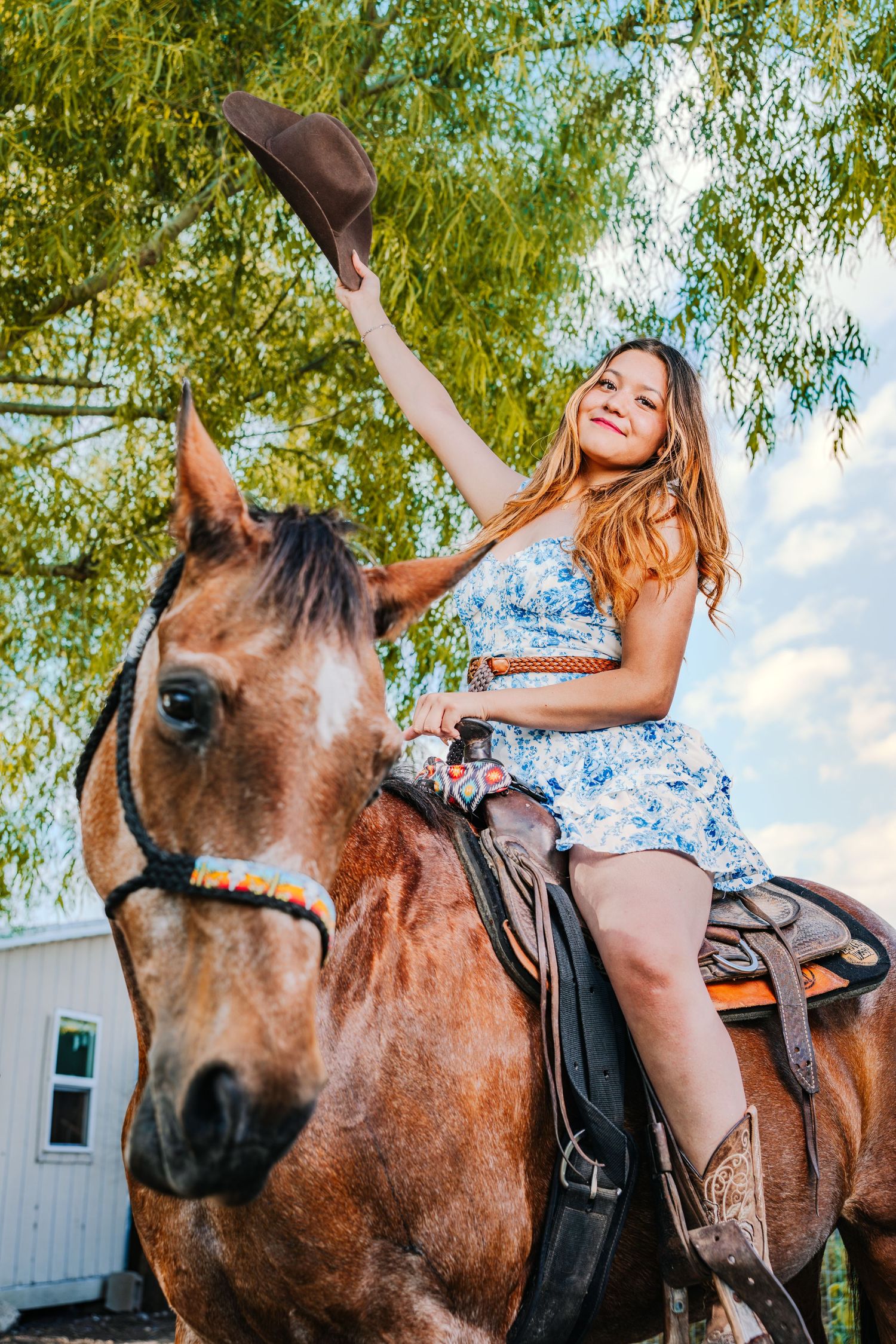 A sequence of photos showing someone riding and posing playfully on a brown horse with a saddle outdoors near trees.
