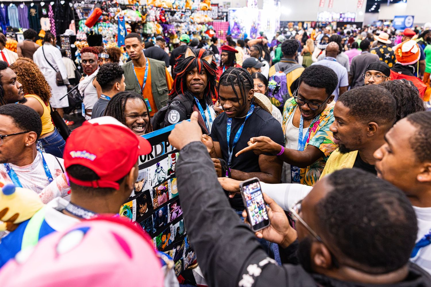 Diverse crowd of cosplay fans gathered at a busy comic convention expo hall floor event.
