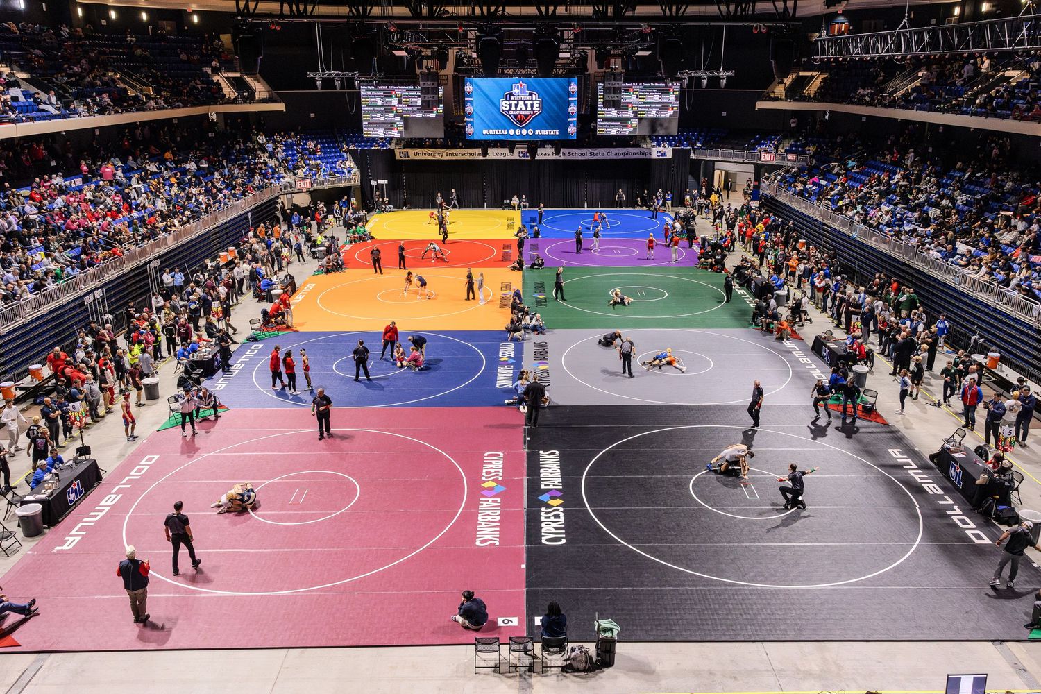 Sequence of wrestling match photos showing competitors on colorful mats in an indoor arena during competition.