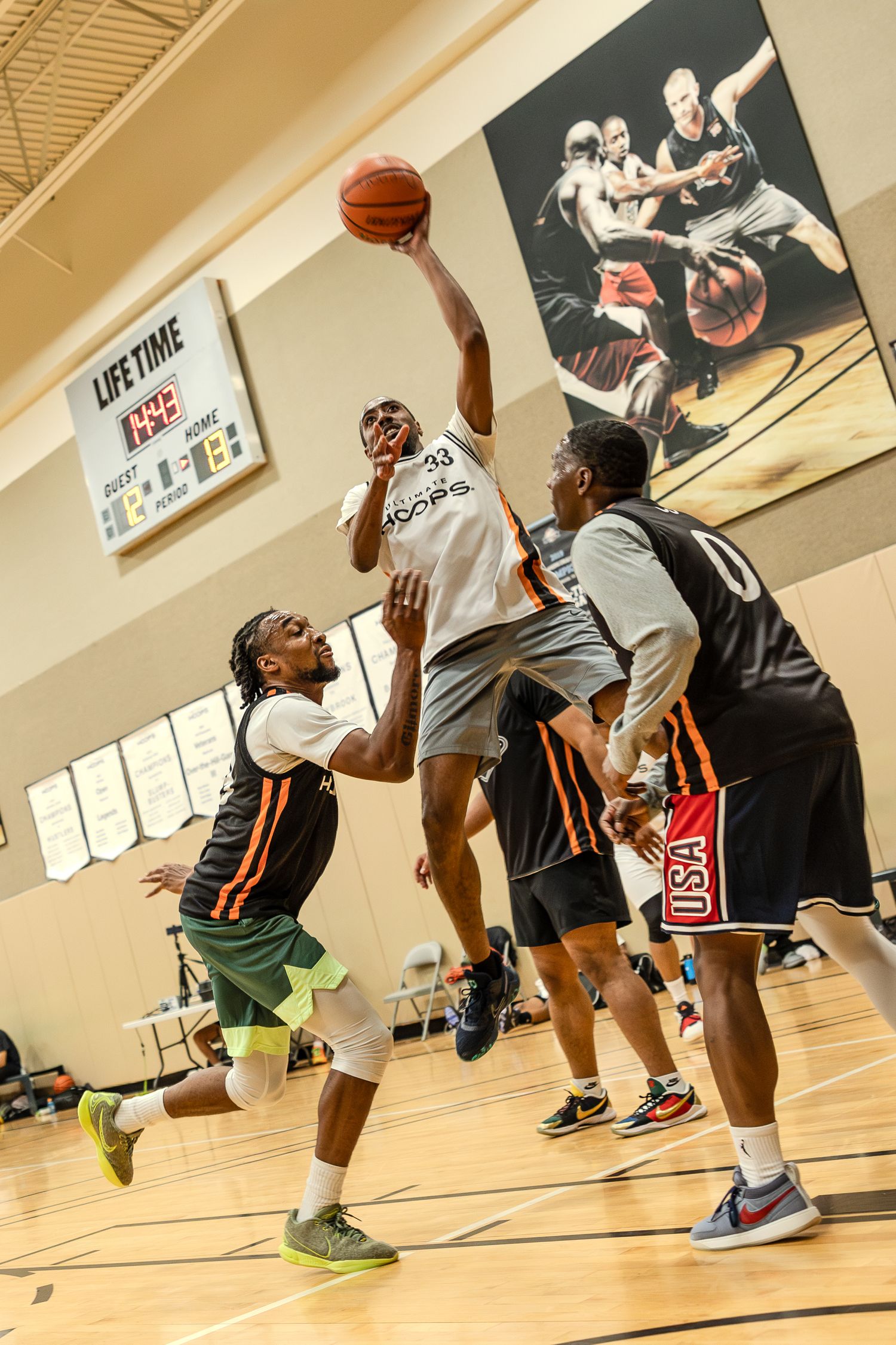A sequence of basketball action shots showing players in a gym practicing layups and jump shots during a game.