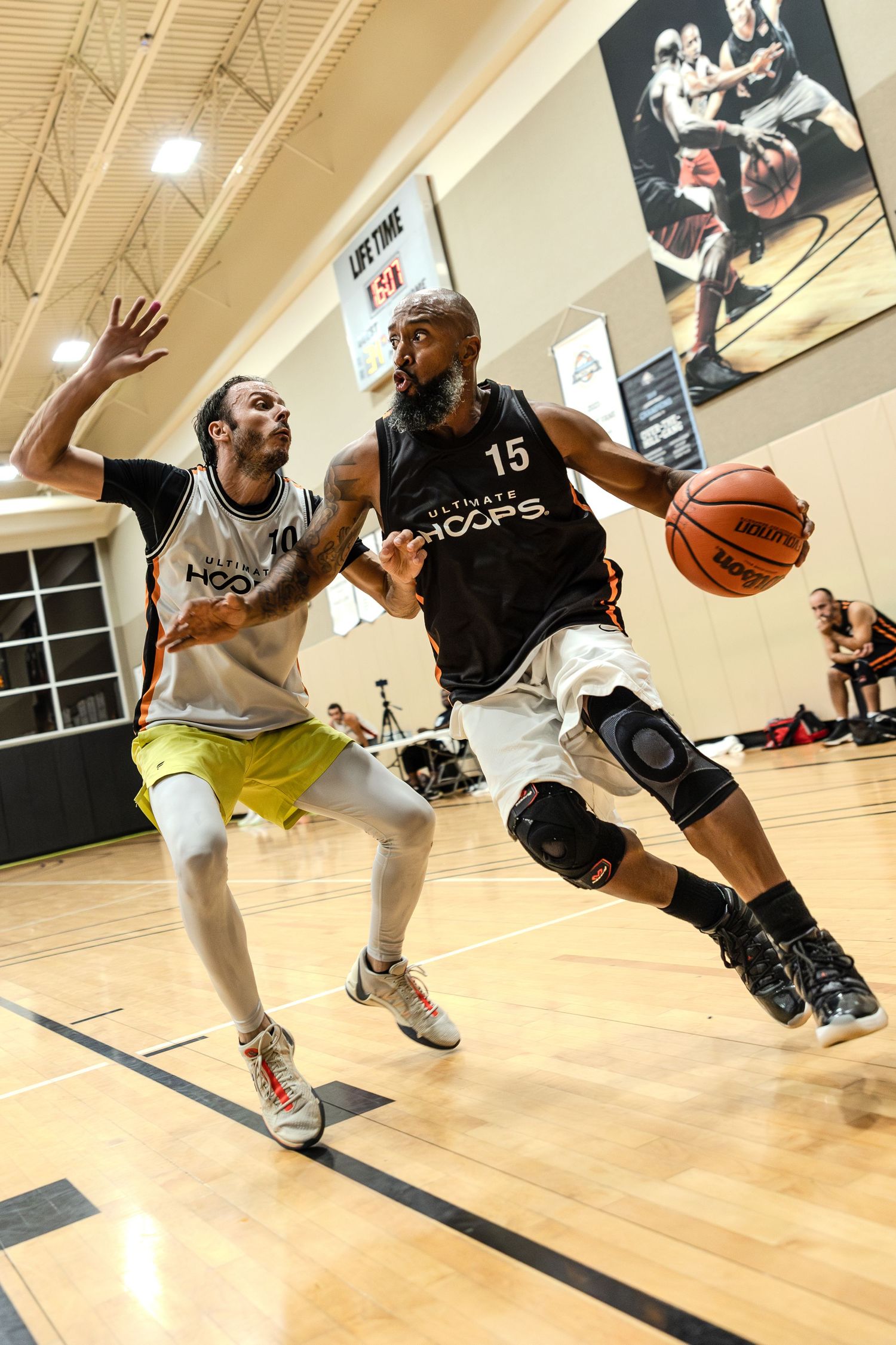 Basketball players battle for possession during an intense indoor game showing multiple action shots on wooden court.