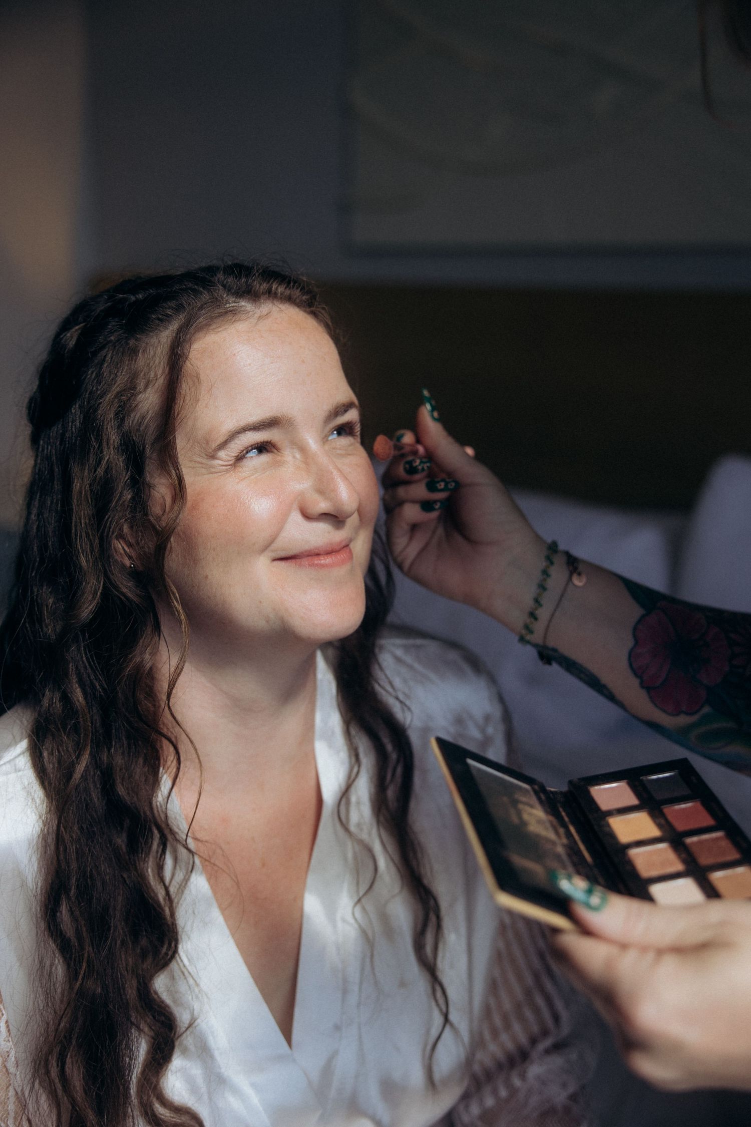 Makeup application sequence during wedding preparation.