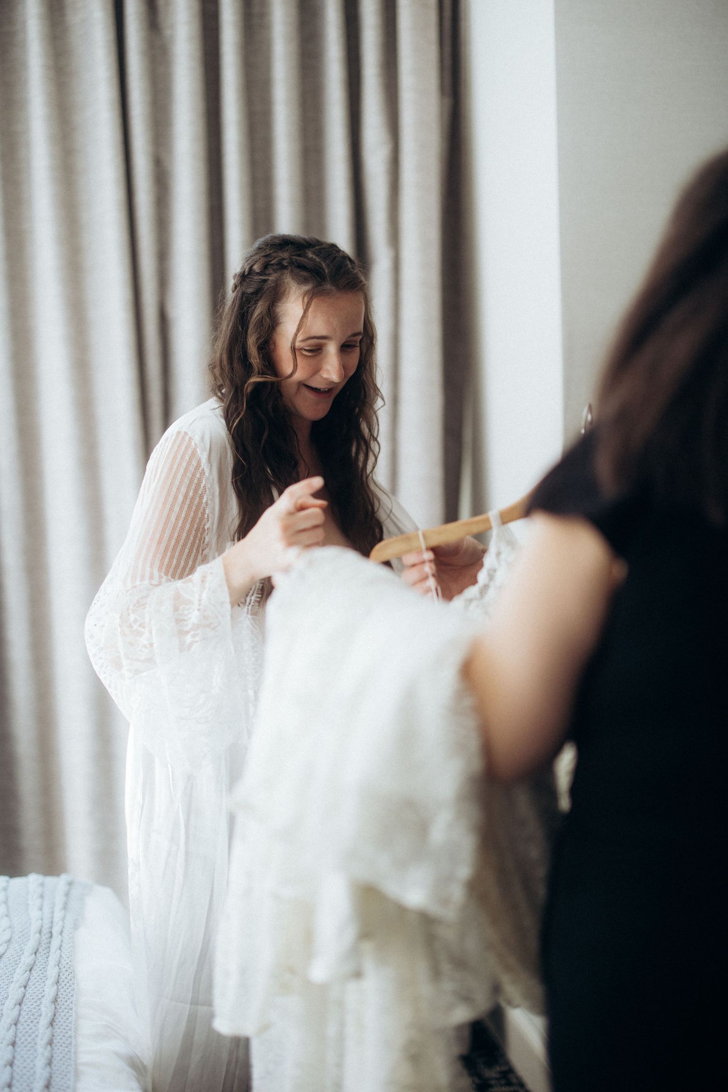 Bride getting ready sequence with white lace details.