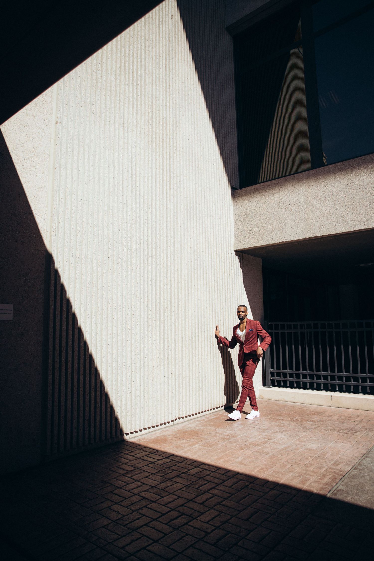 Architectural photo series with dramatic shadows and silhouettes in a geometric space.