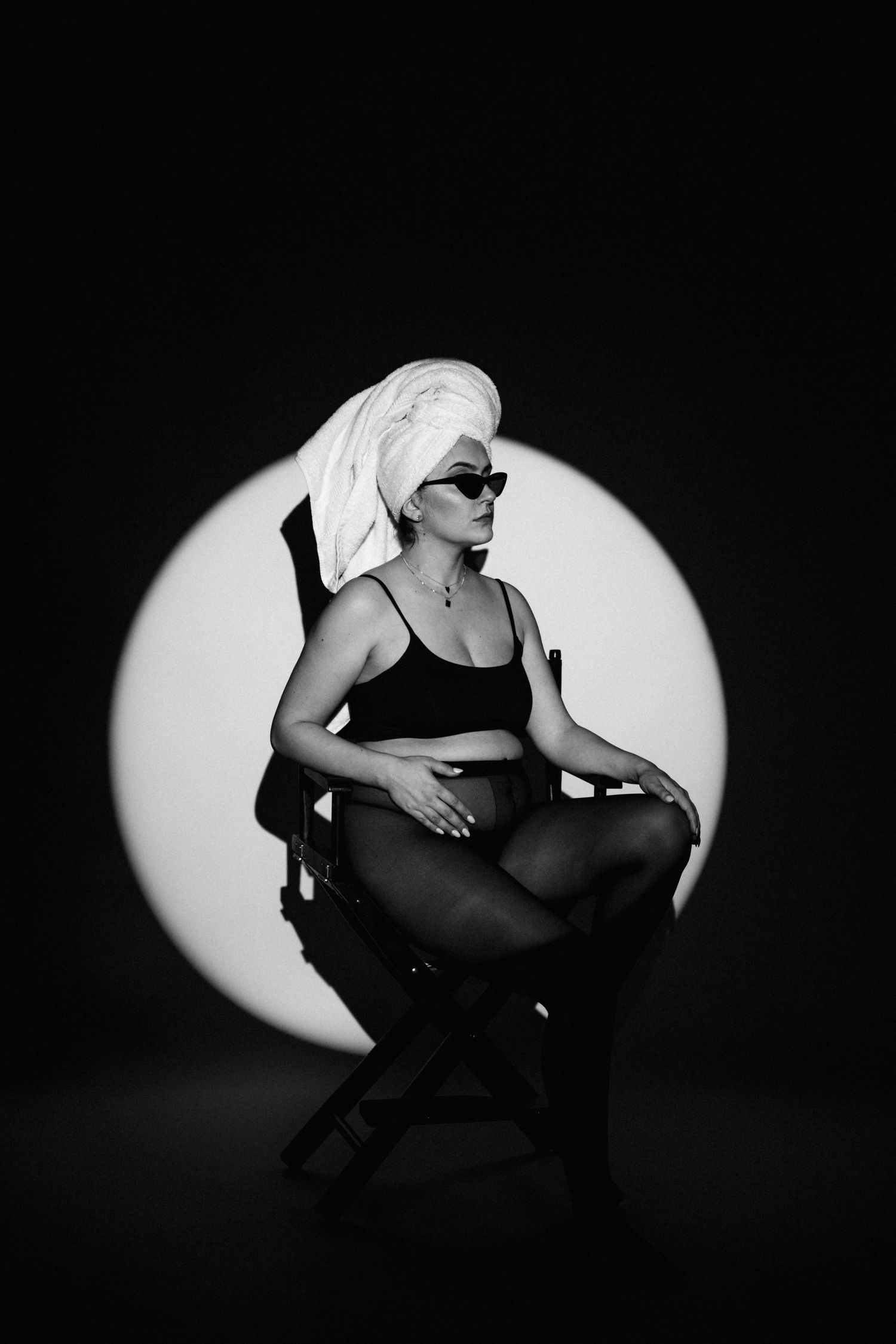 Dramatic spotlight portraits in black and white showing dynamic poses.