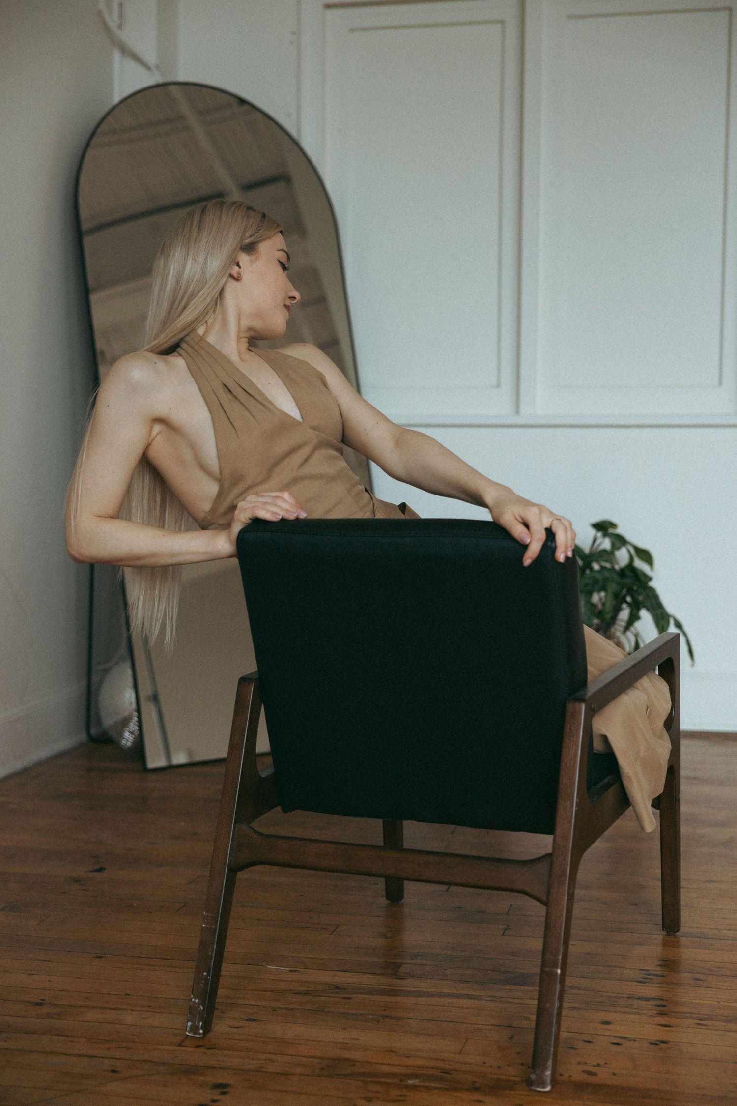 Artistic poses on black chair showing movement and drama.