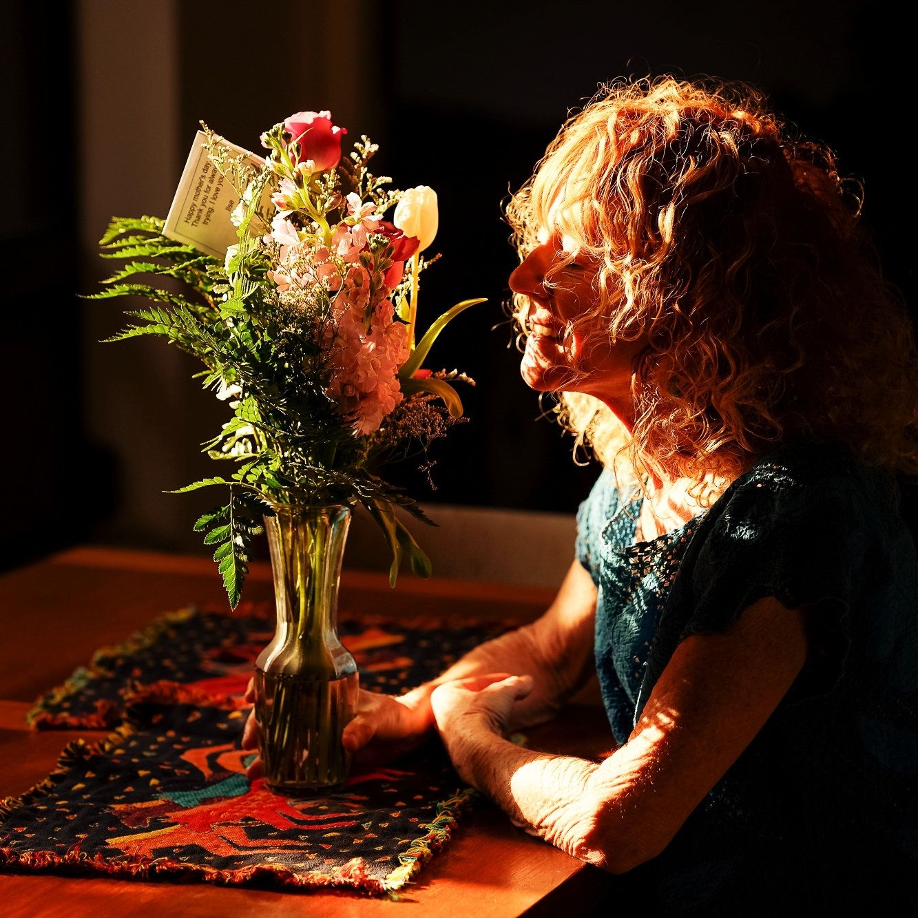 A sequence of photos showing a figure in motion against a dark background with dramatic lighting and ferns.