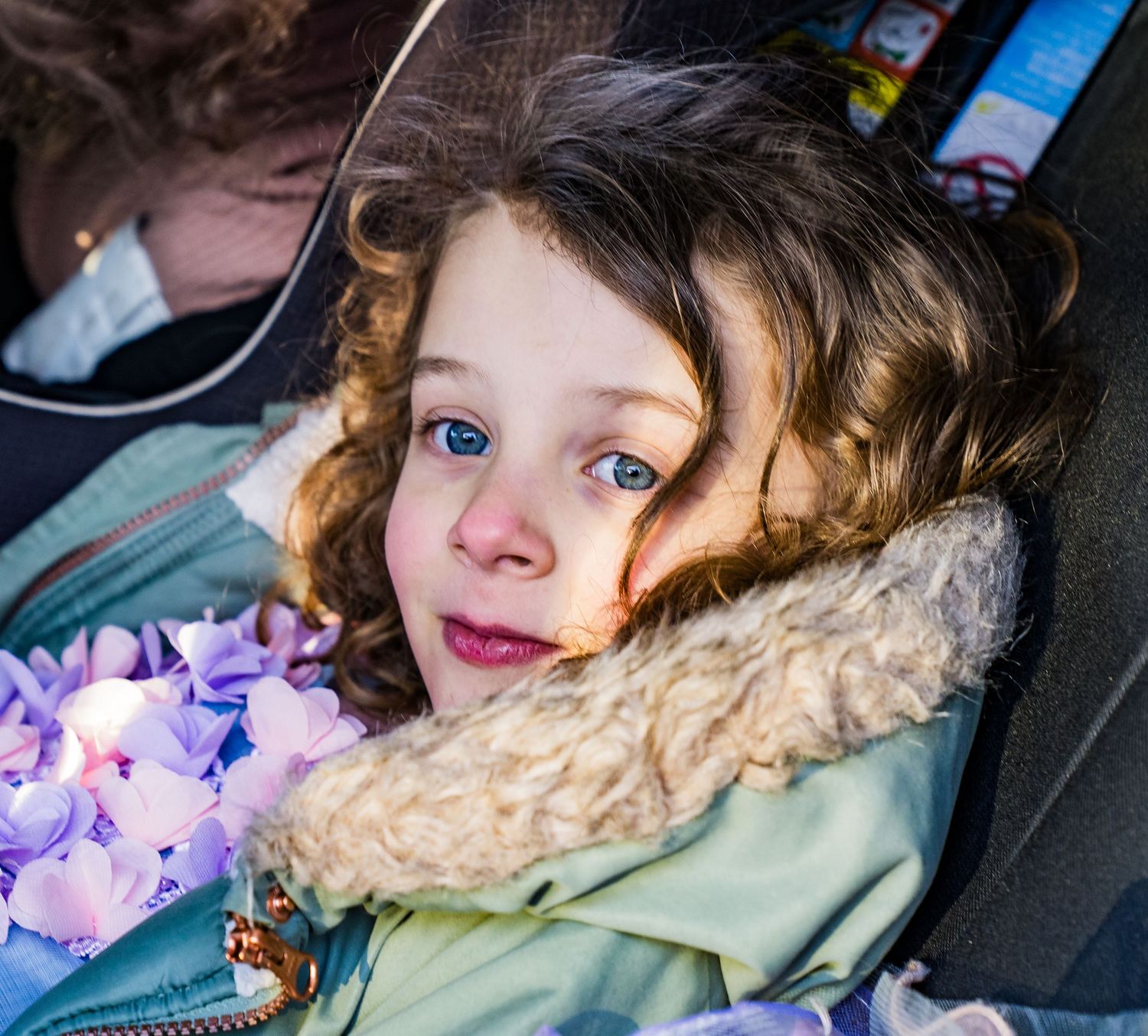 A series of five similar photos showing someone resting against a car window with soft purple lighting.
