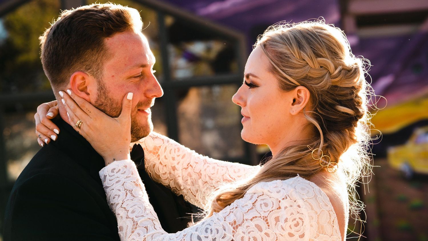 A couple shares an intimate moment together at sunset, with multiple candid shots showing their joyful expressions.