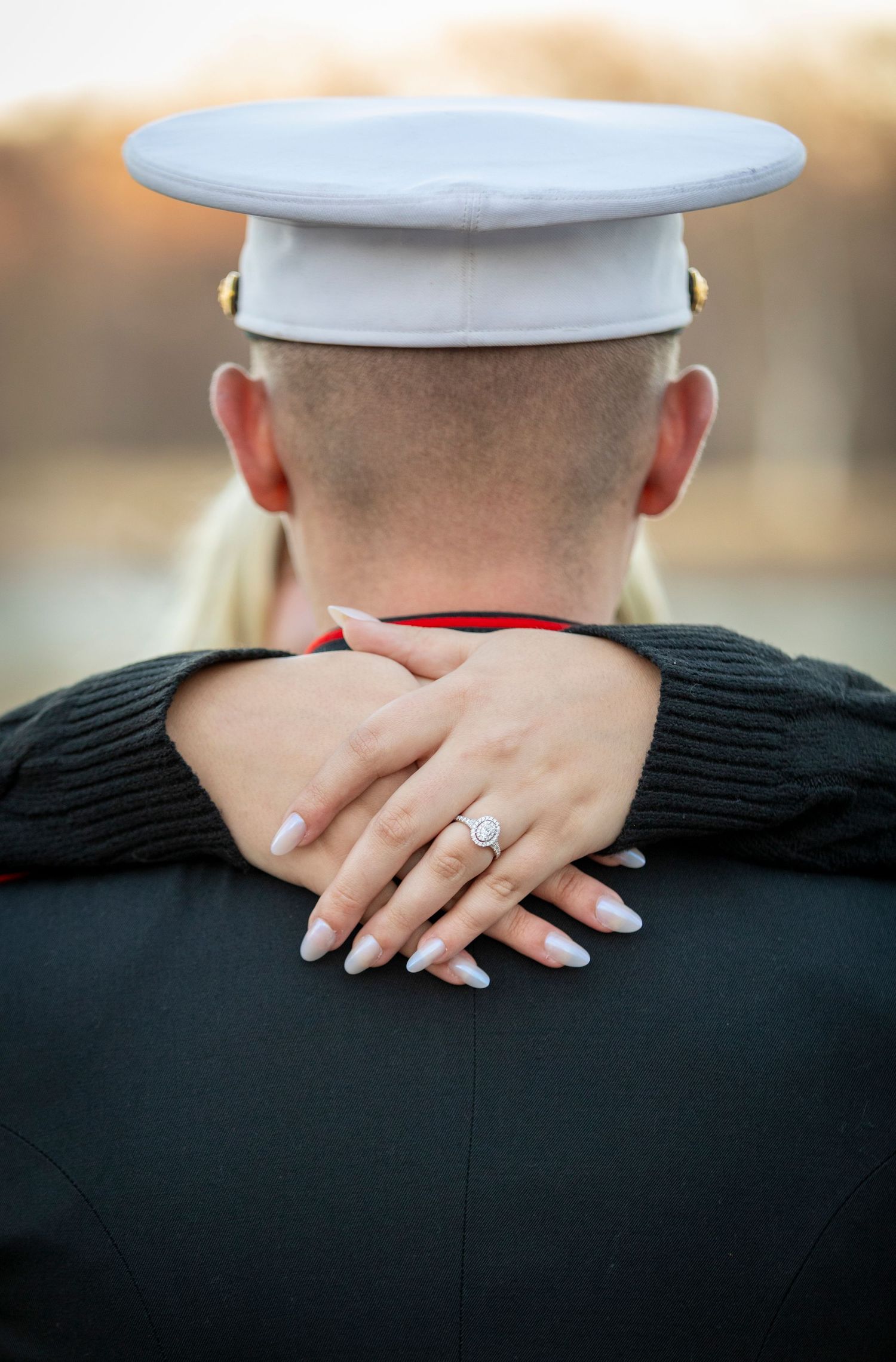 Marine engagement session with a diamond ring