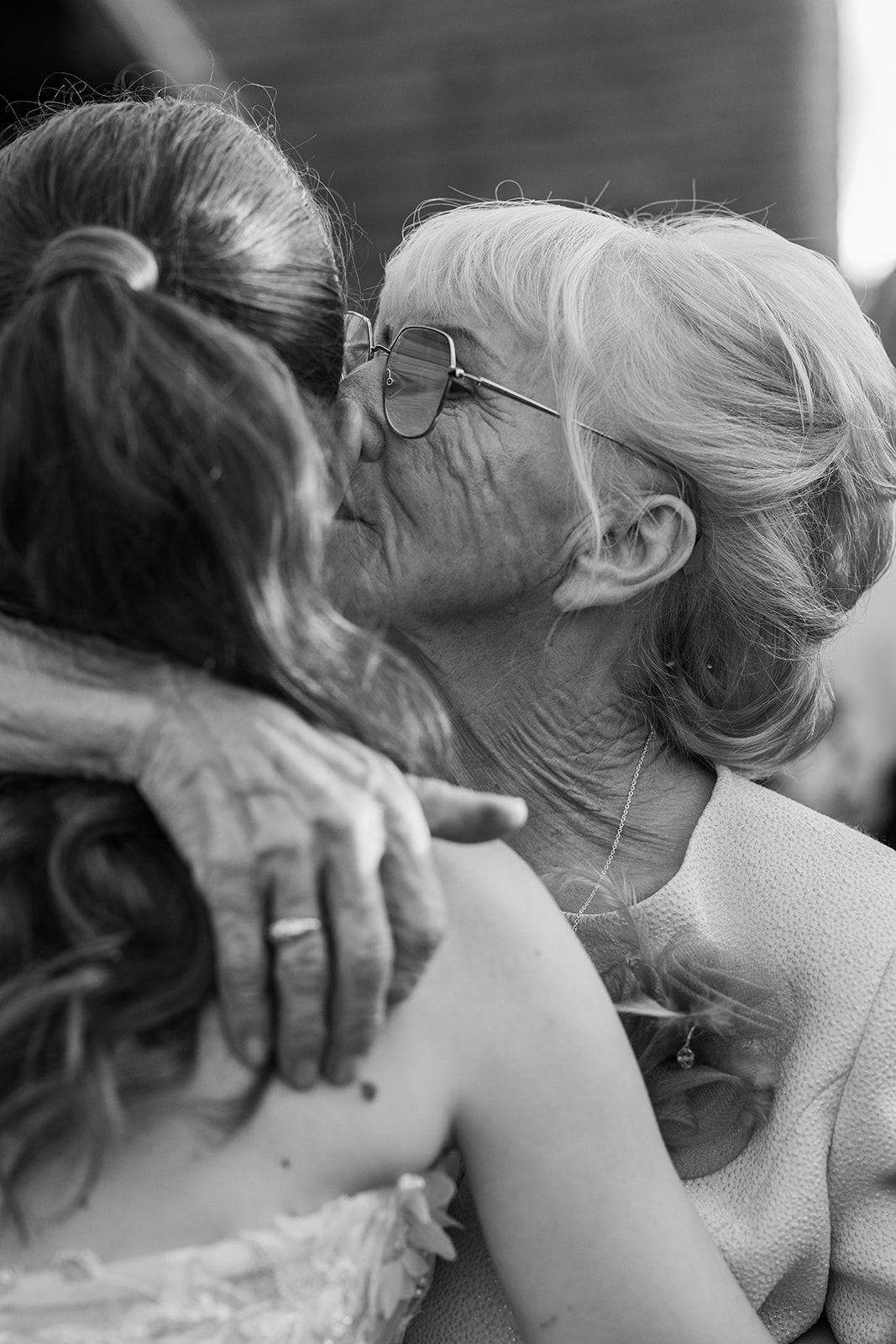 Black and white photo sequence showing intimate wedding moments between a couple.