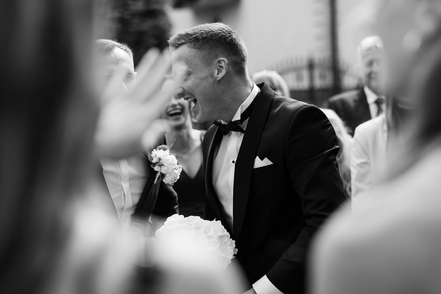 A romantic black and white wedding photo series showing intimate moments between a couple during their special day.