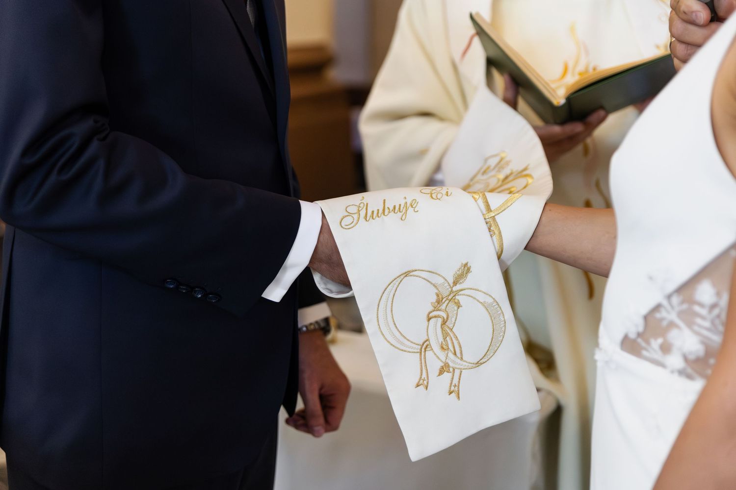 Custom wedding program with gold heart design held during church ceremony between couple exchanging vows.