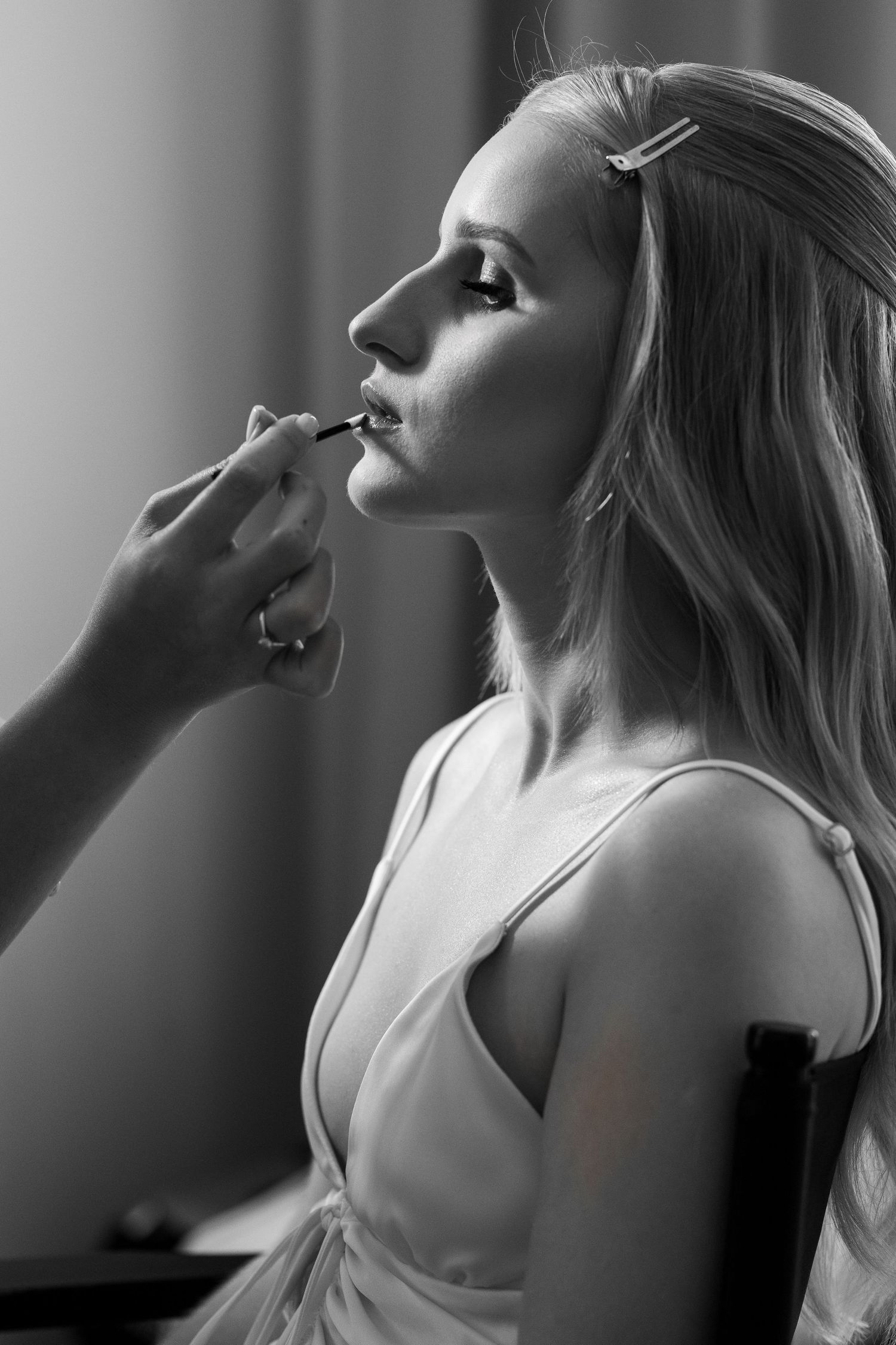Artistic black and white portrait series showing a person's profile in dramatic lighting and different poses.