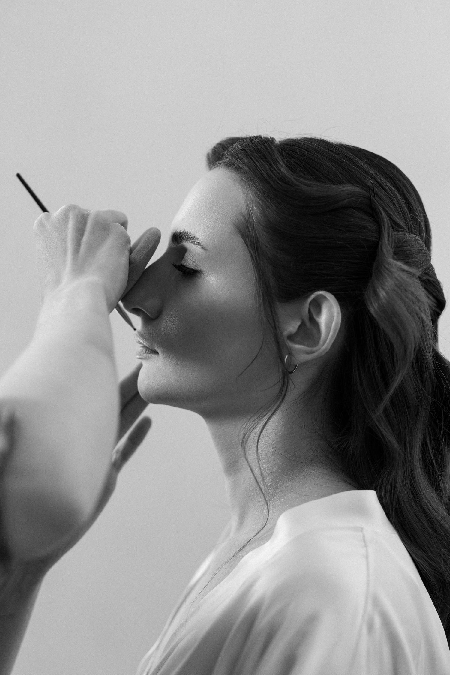A black and white profile image sequence showing a figure drinking from a glass in four progressive stages.