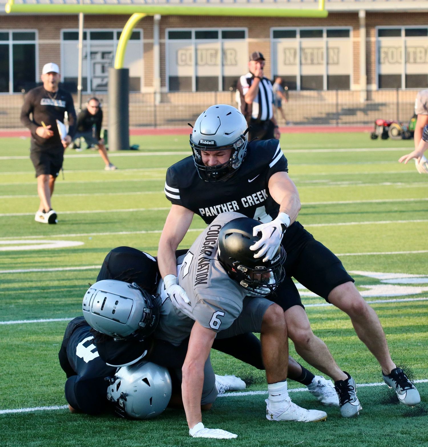 High School scrimmage football game action photographed in Dallas, Texas by Precision Photos TX photographer