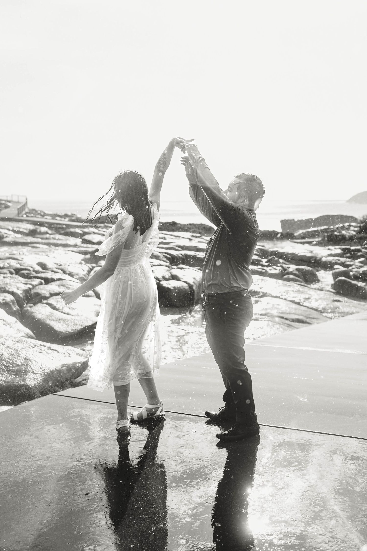 romantic rain wedding love dancing in rain black and white