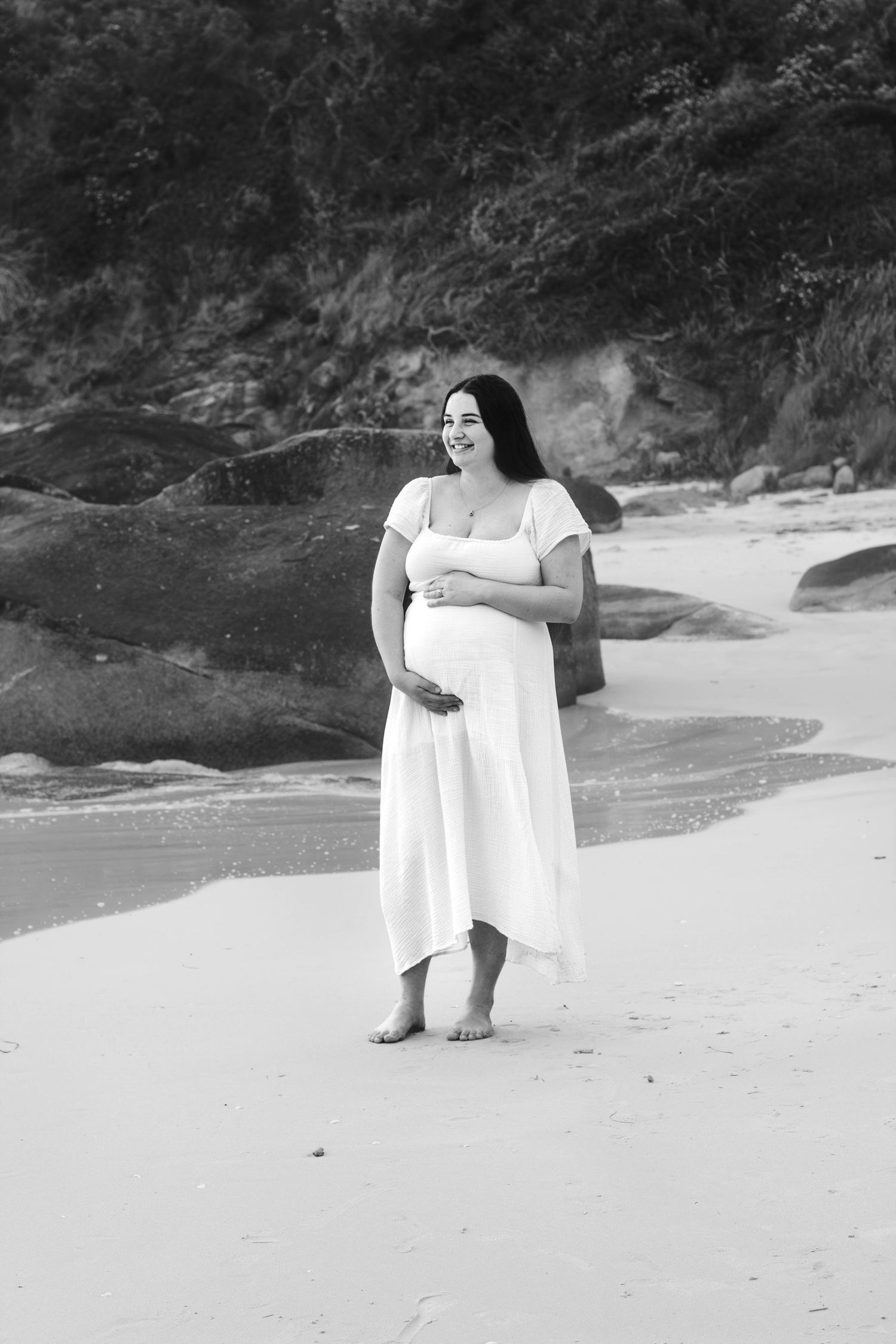 Artistic black and white beach portraits with dramatic coastal scenery.