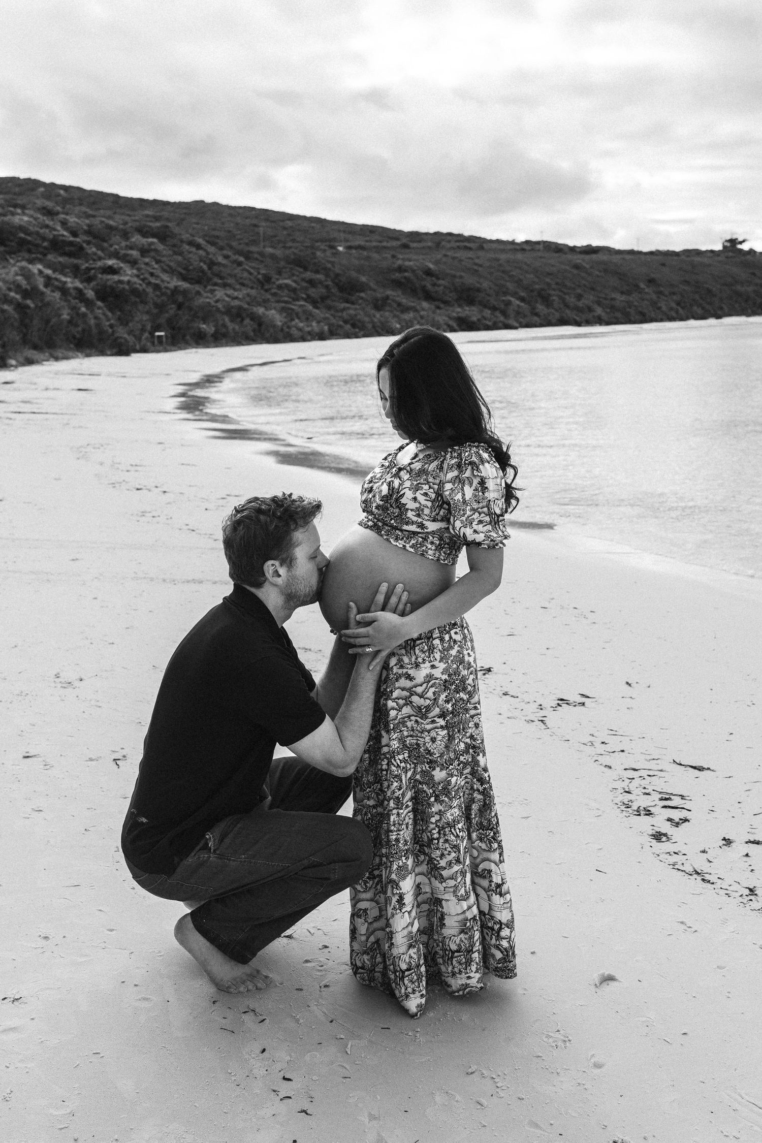 maternity picture beach kissing belly love black and white