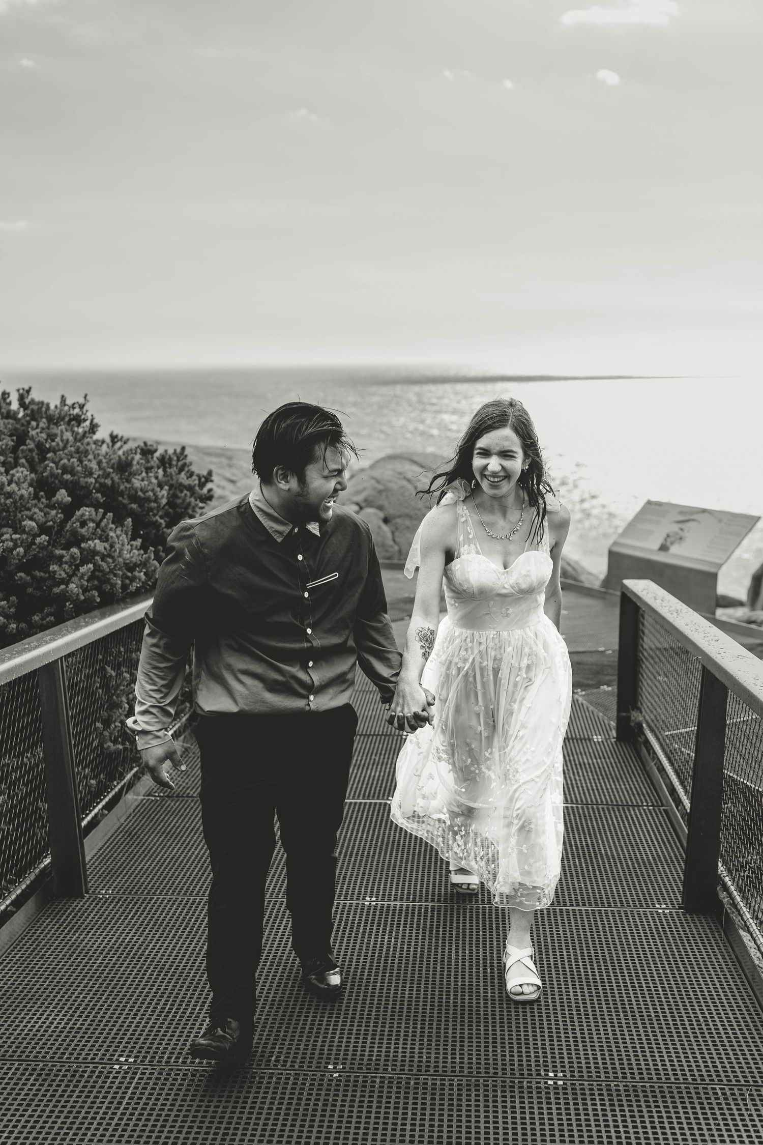 romantic running in the rain wedding black and white