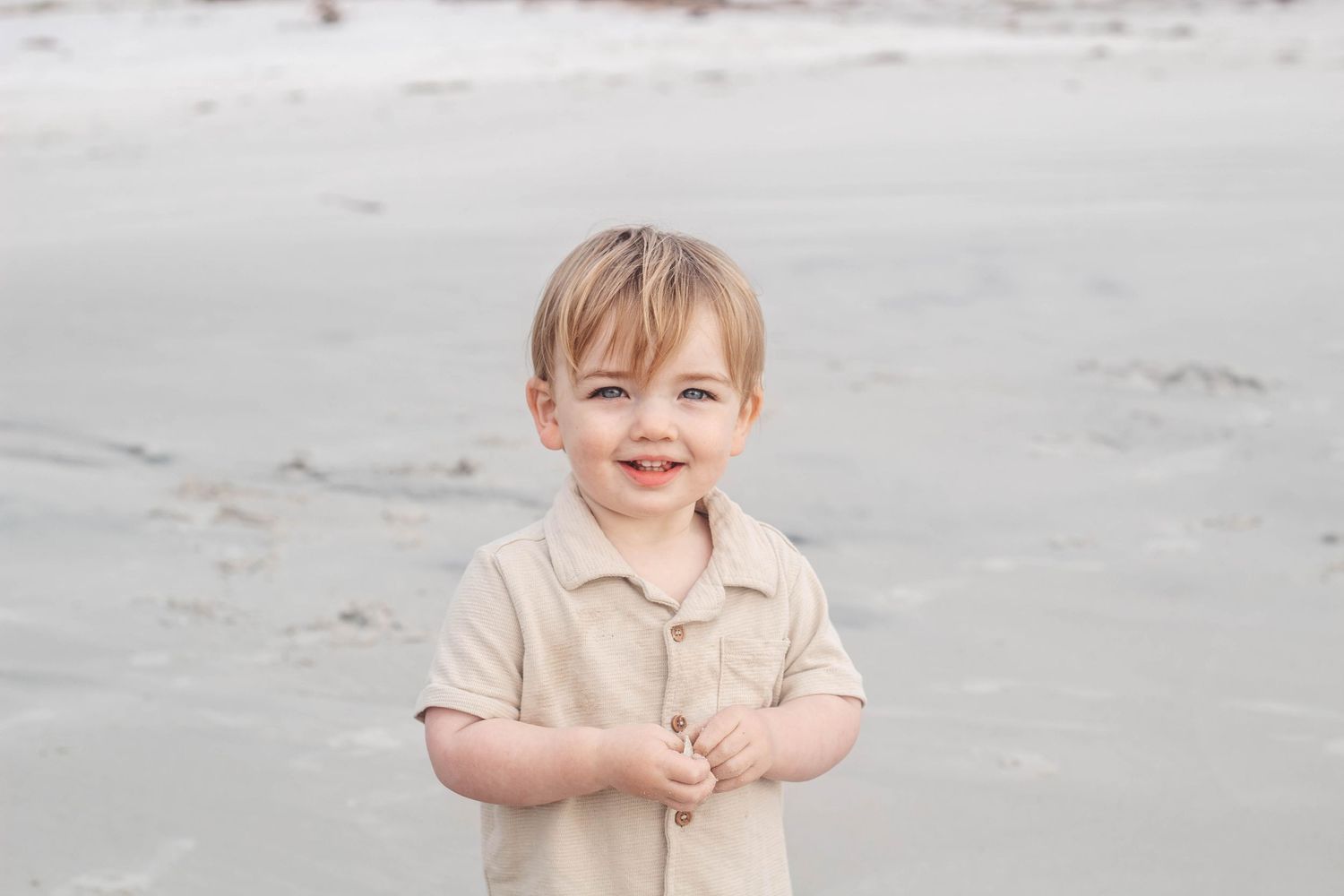 happy toddler at the beach