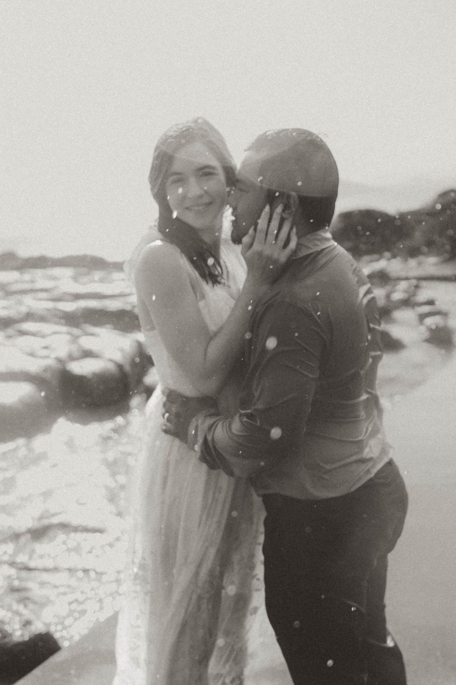 romantic rain wedding love dancing in rain blurry black and white