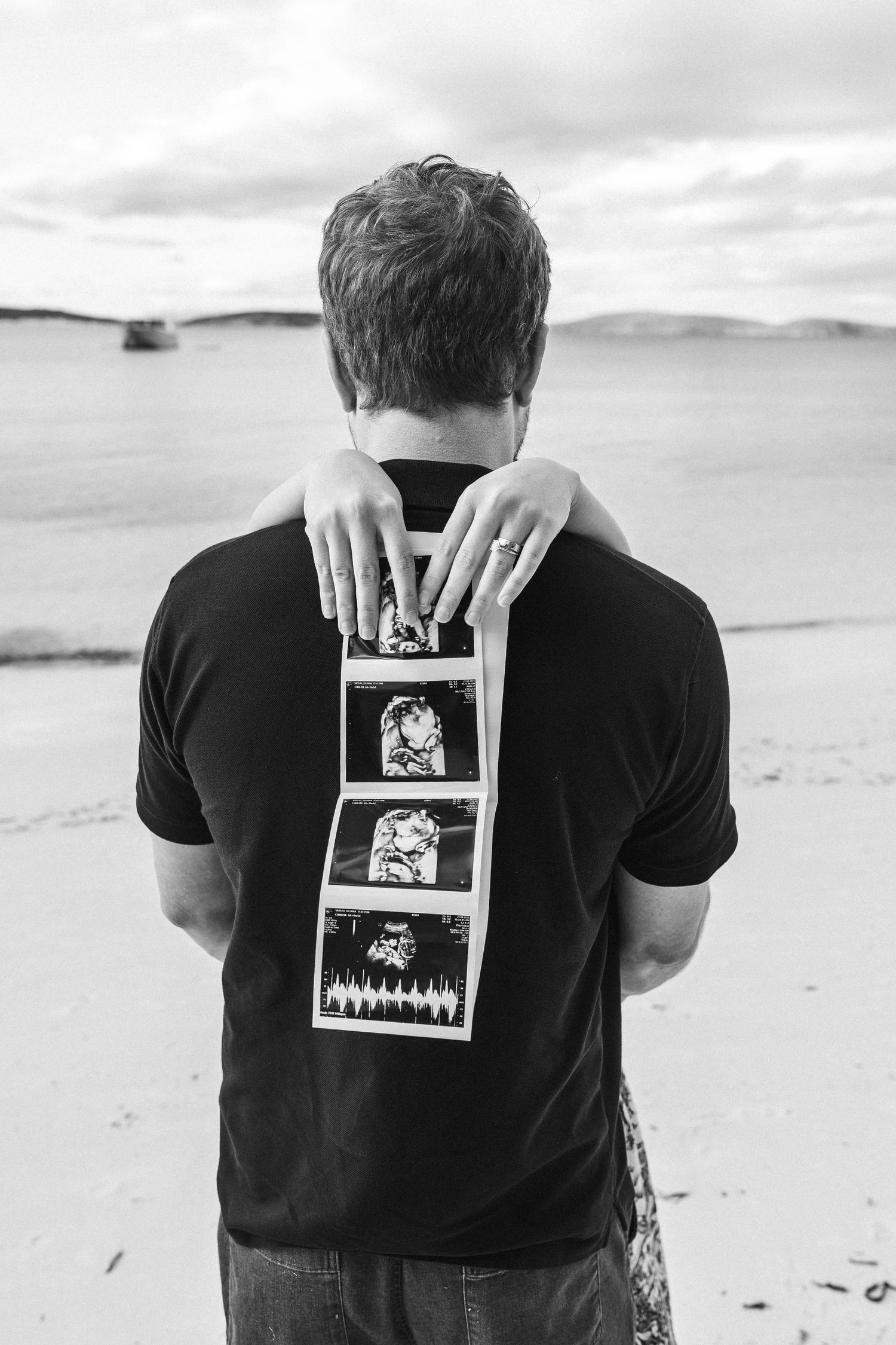 maternity picture beach couple love sonogram black and white