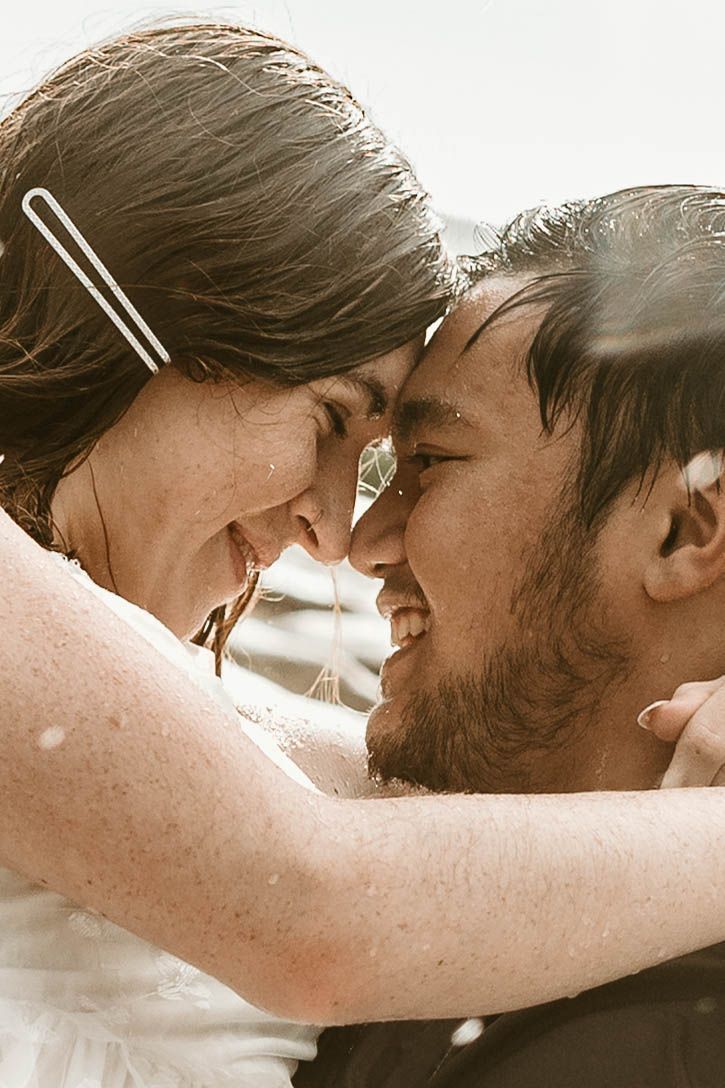 romantic rain wedding love up close nose to nose