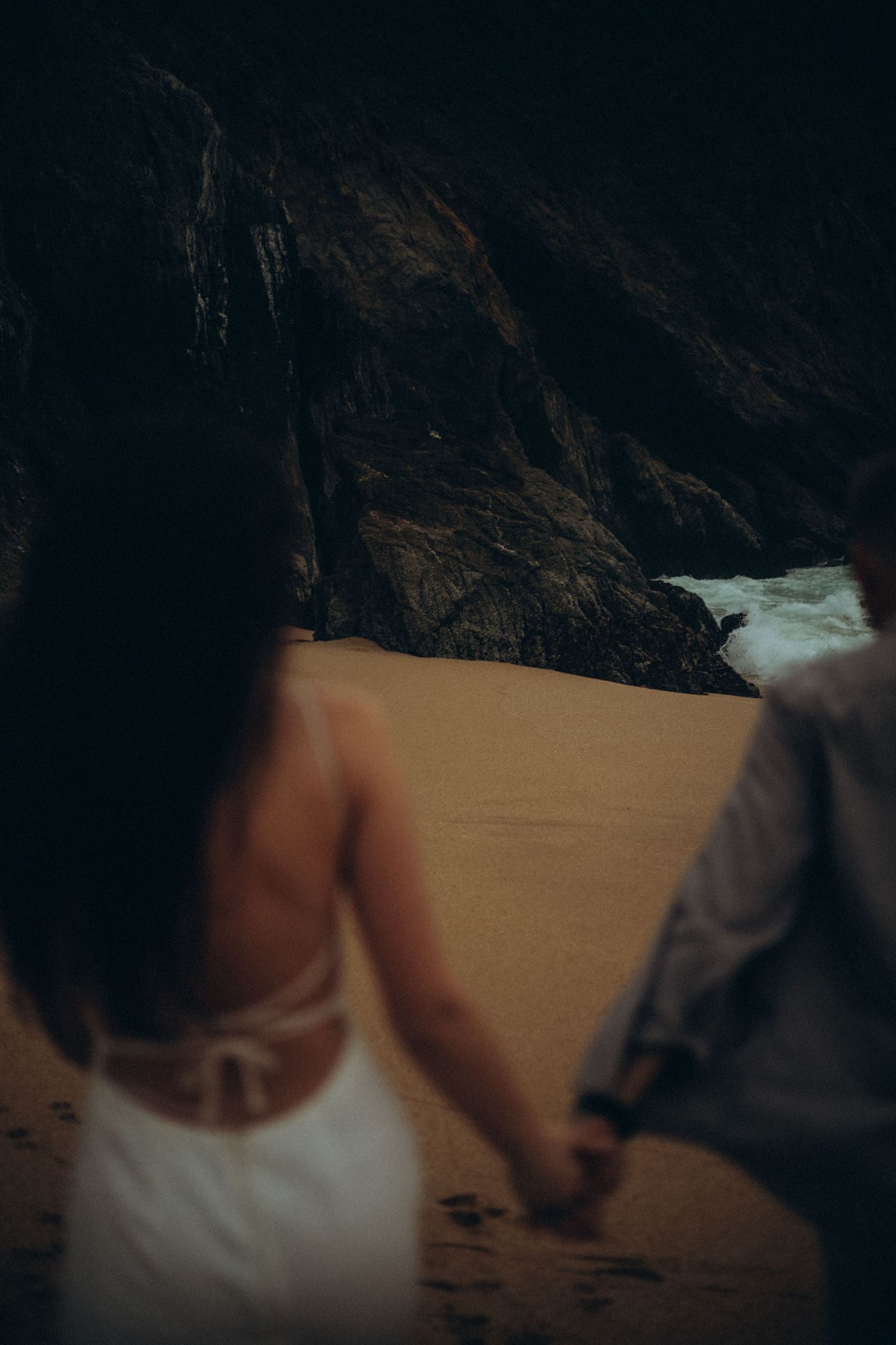 Love story on the beach in California with emotional, candid moments