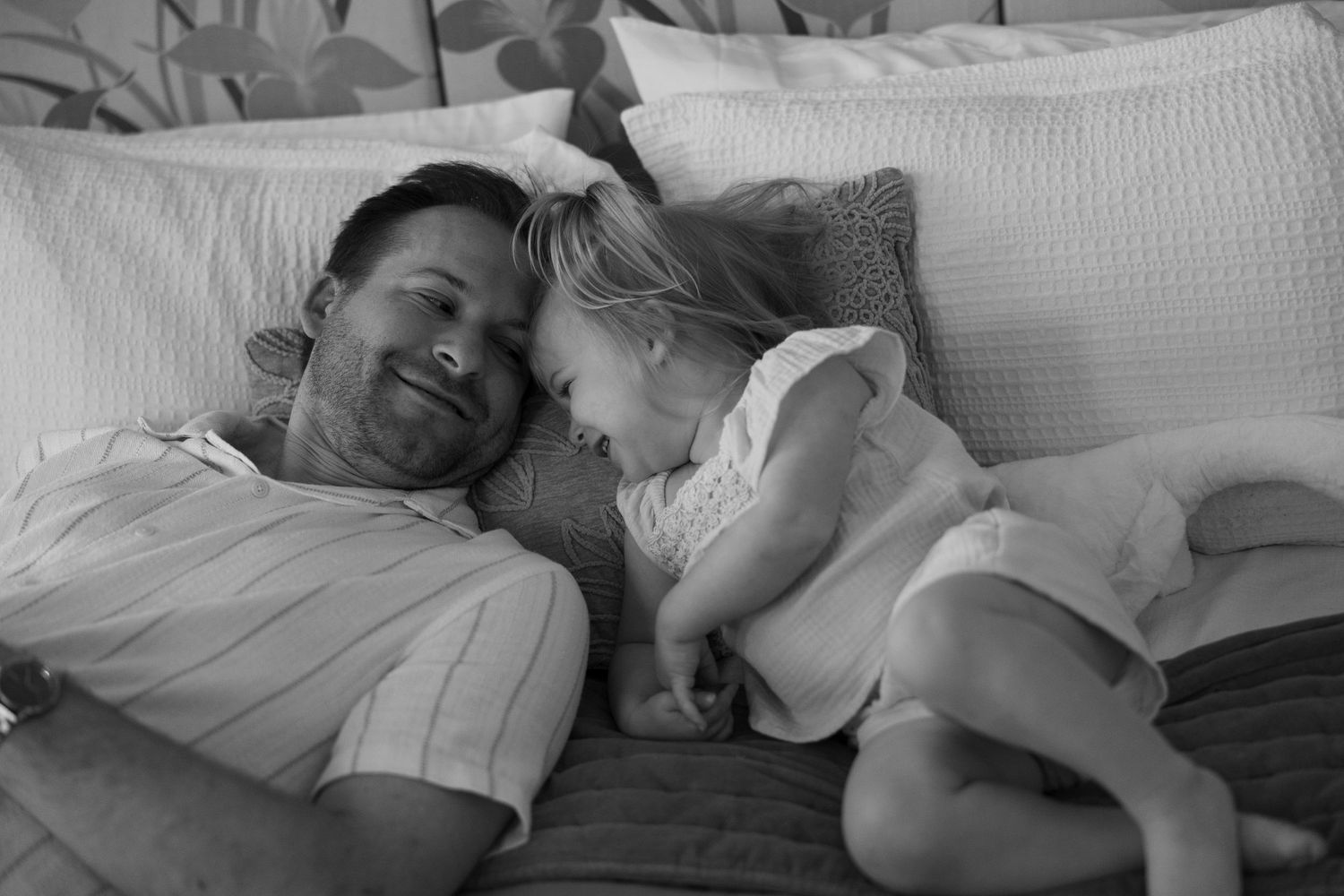 Sweet candid family moments captured in black and white photography.