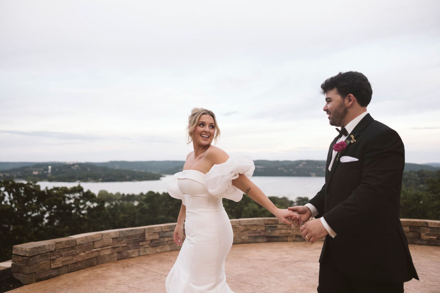 Romantic seaside wedding portraits with dramatic coastal views in the background.