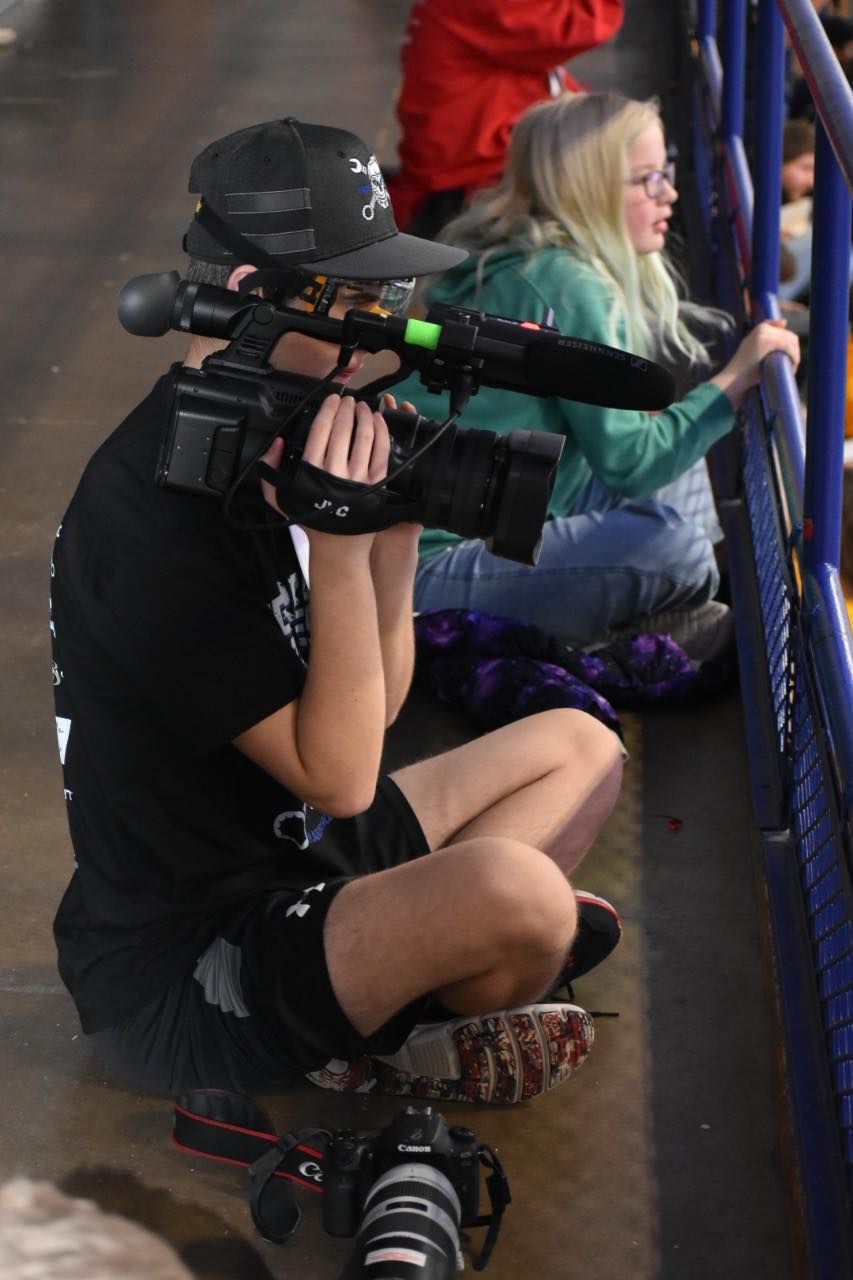 Wyatt Szucs Taking Video During Robotics Competition