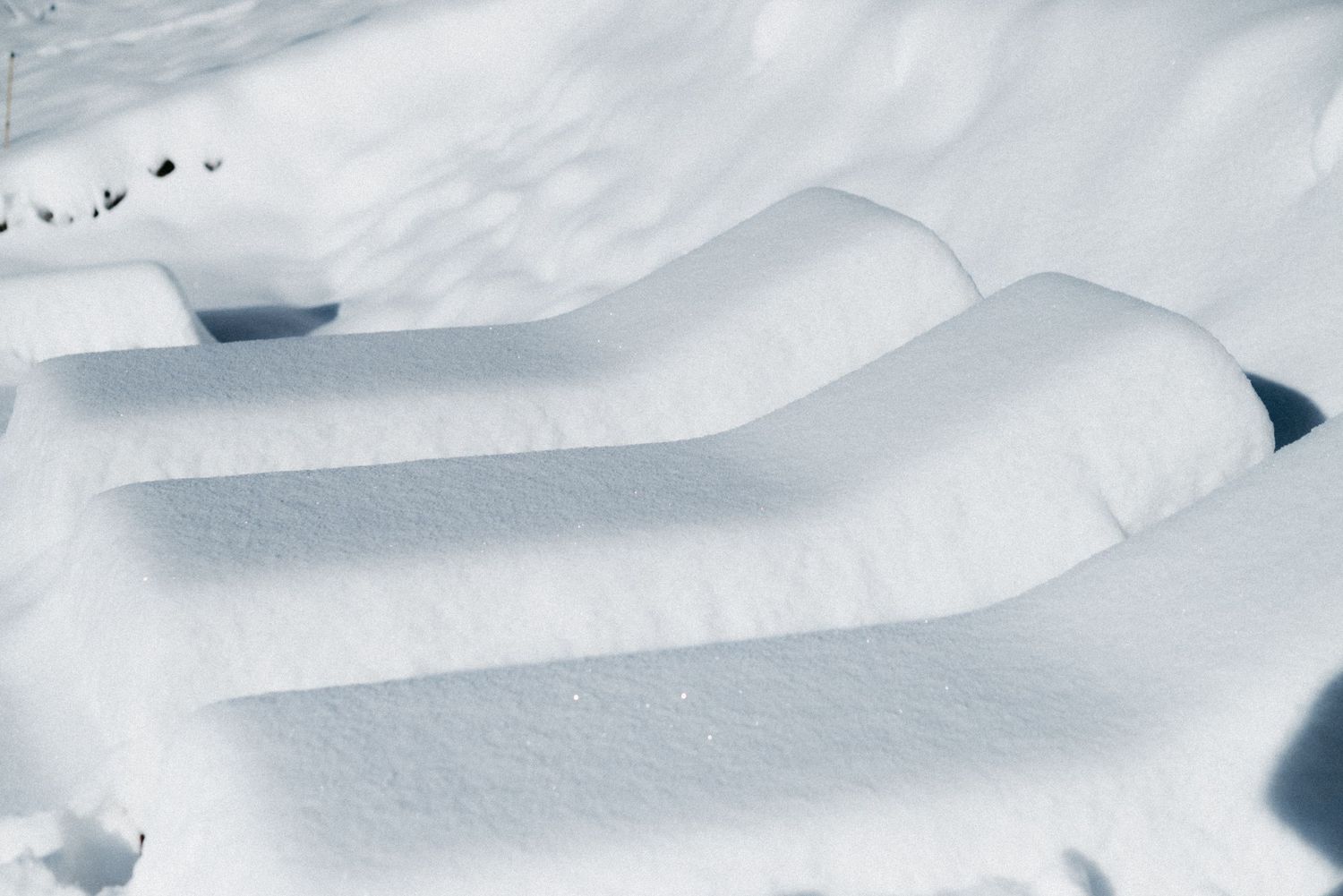 Minimalist French Alps content creation featuring sculptural snow-covered steps and soft winter light.