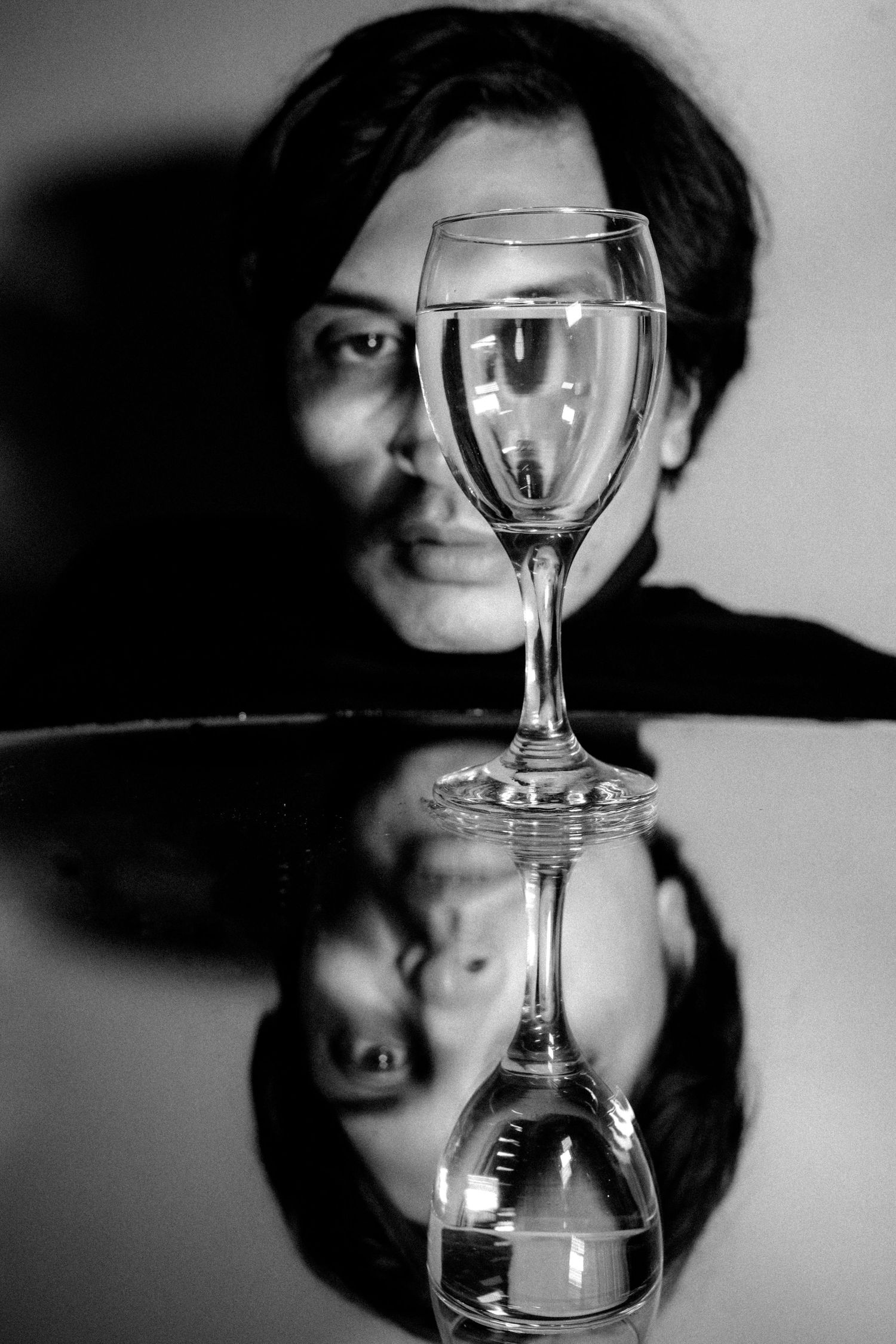 Artistic black & white Paris portrait using glass reflection, conceptual fashion photography with abstract elements. Photo - Studio Reverie