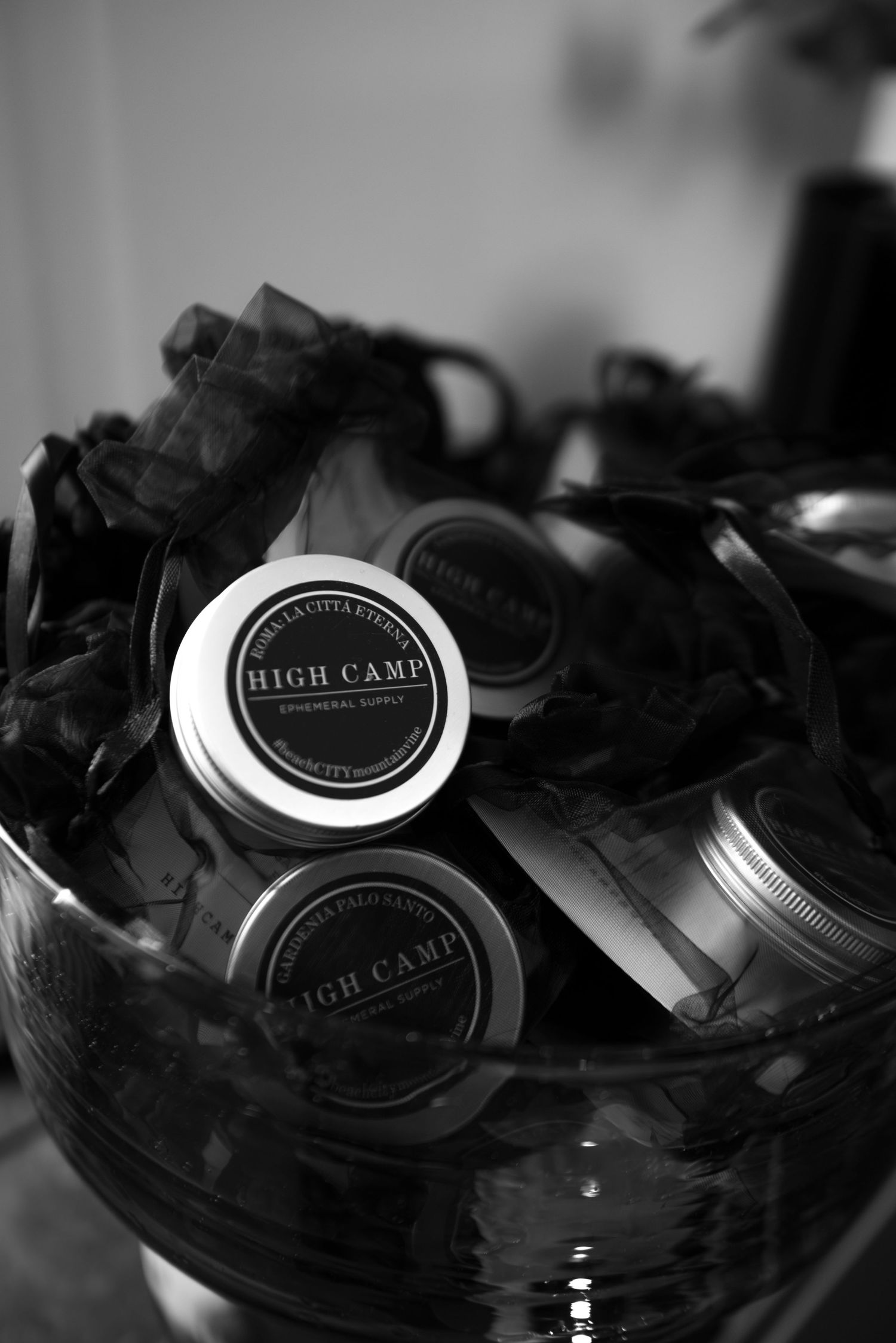 Editorial product detail of High Camp candle at Paris event, cinematic black and white photo of luxury candles and textures