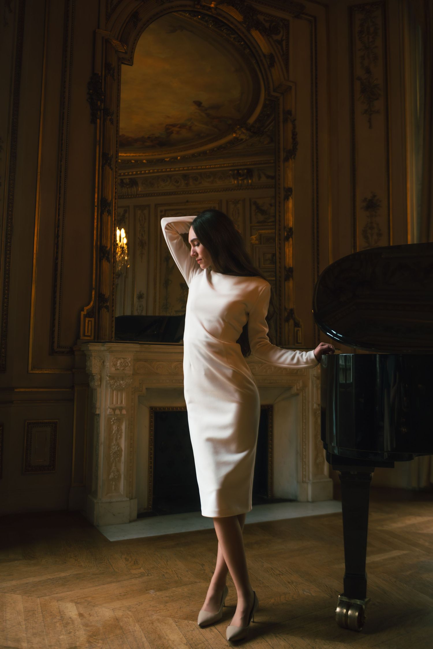 Artistic portrait in Paris with elegant woman in white beside piano, editorial and timeless French atmosphere