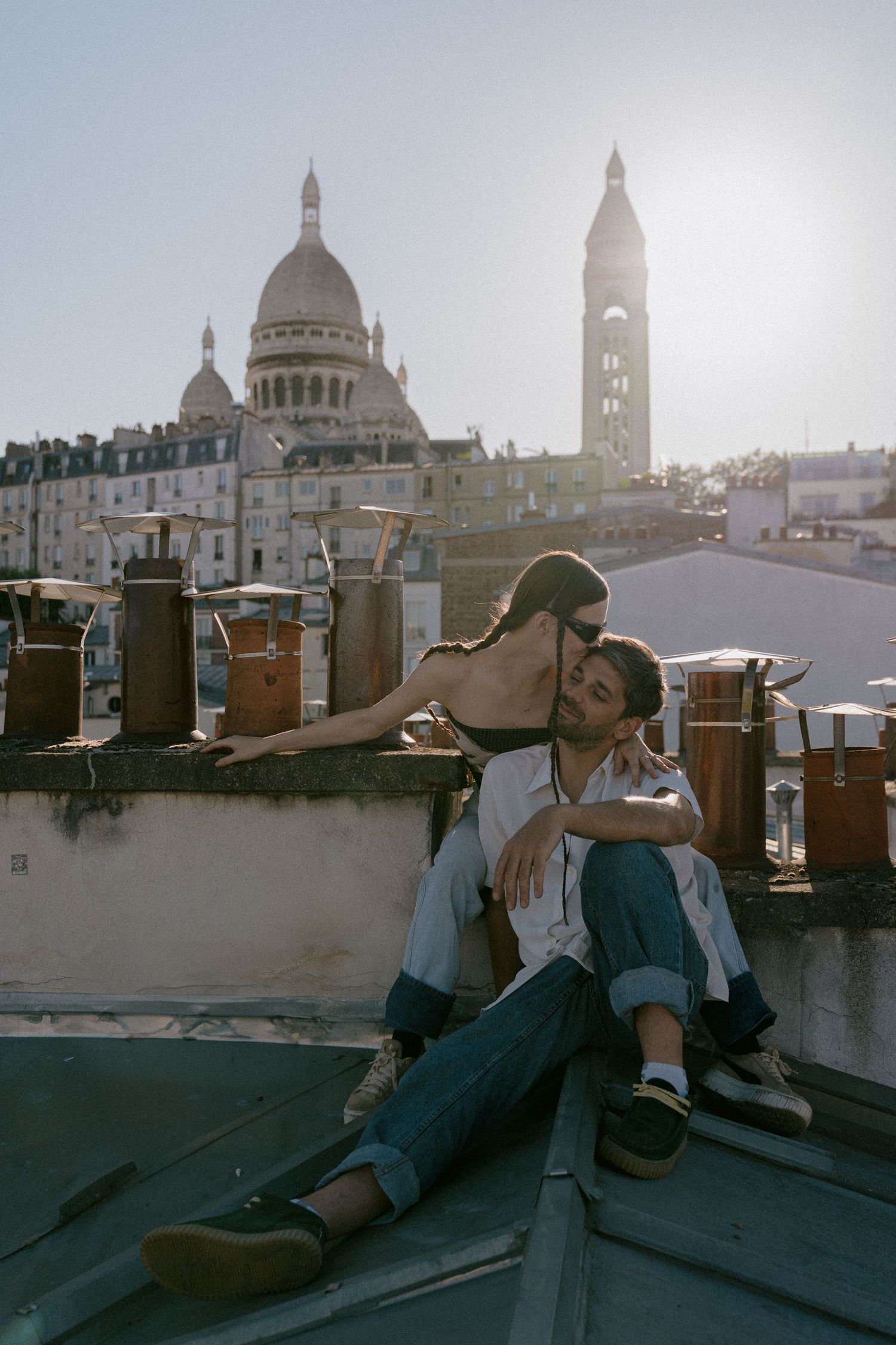 Rooftop scene with Sacré-Cœur Basilica dome in Paris skyline.