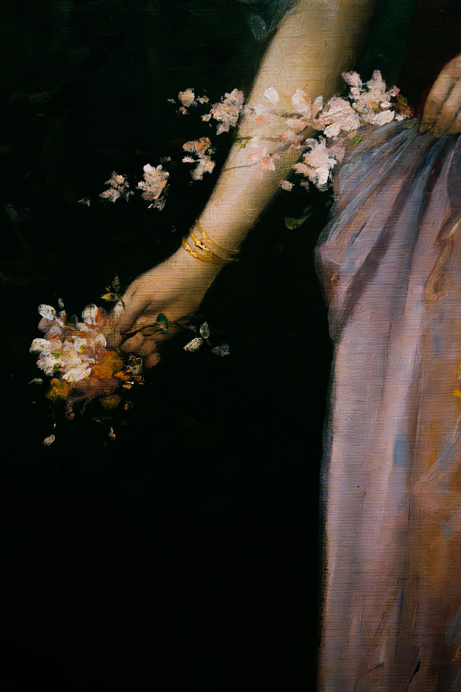 Delicate pink cherry blossoms bloom against a dark background in an ethereal artistic composition.