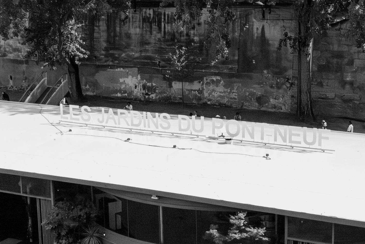 Rooftop scene in Paris captured in black and white, moody editorial event detail from Pont Neuf installation