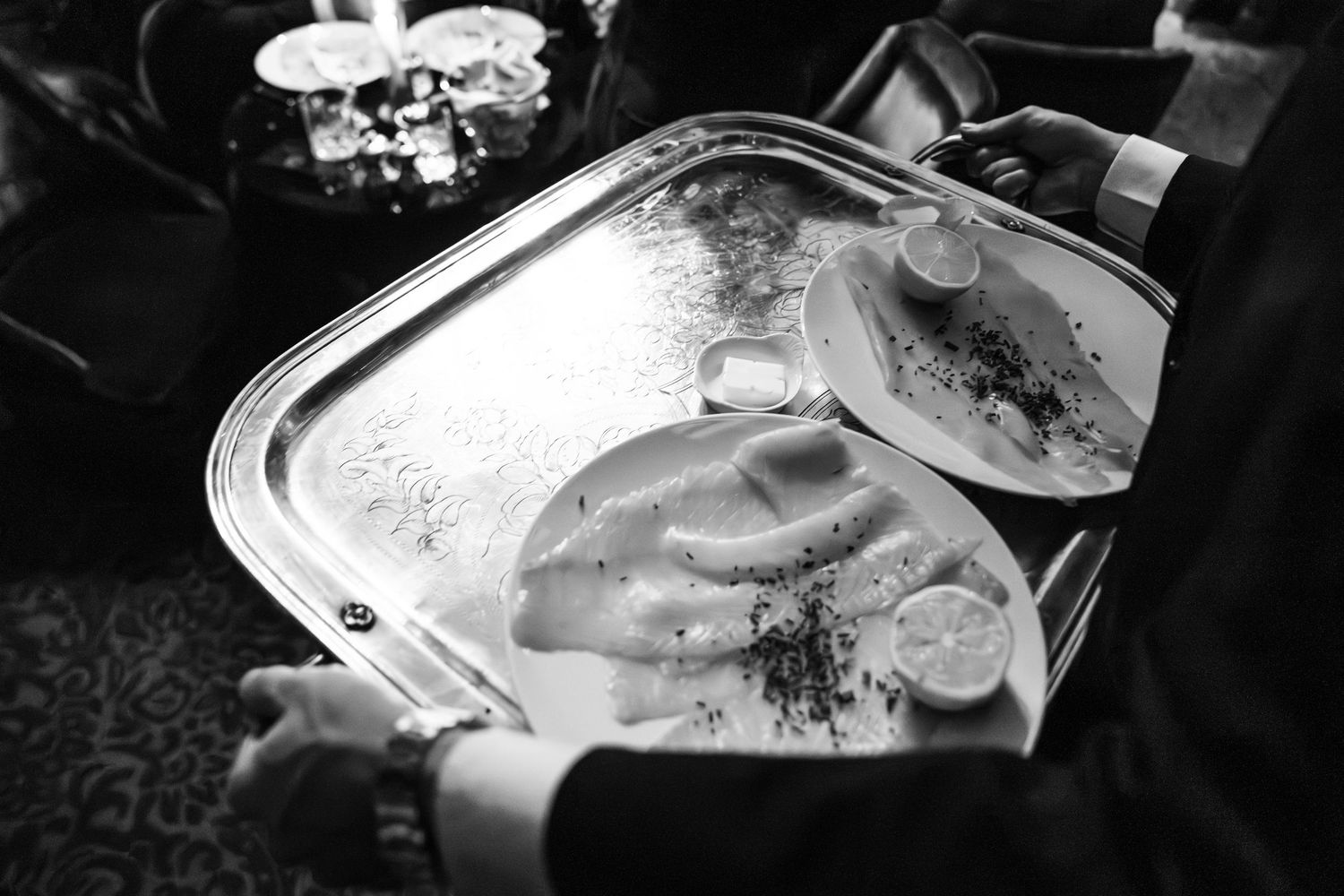 Close-up black and white detail shots of wedding food presentation.