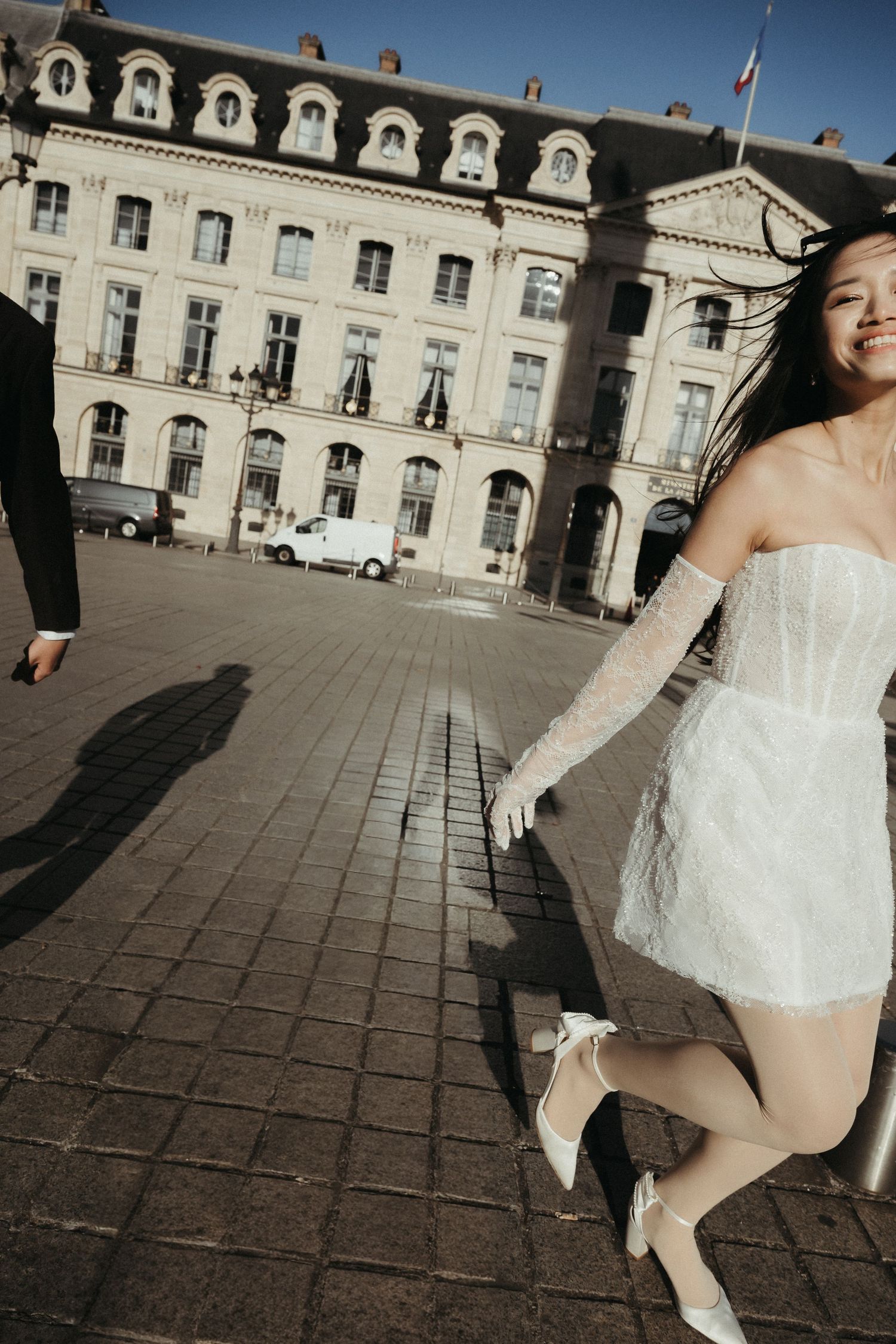 Sequence of dance movements in white dress against classical architecture backdrop.