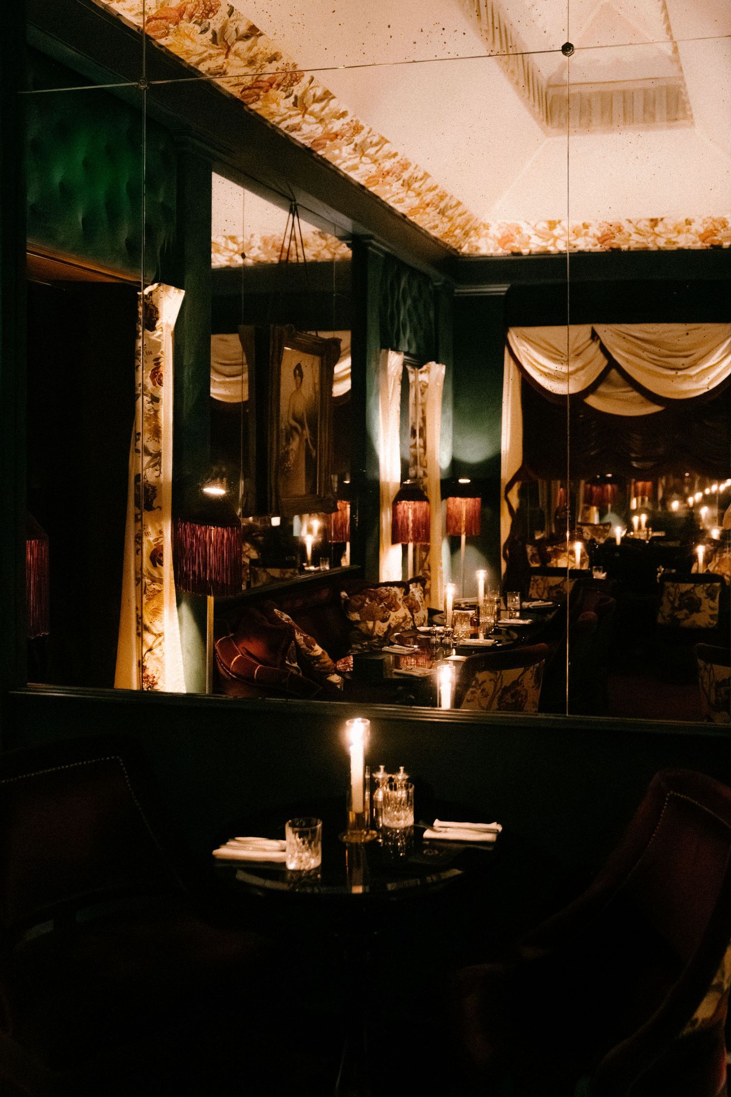 Elegant restaurant interior with ornate ceiling trim and soft lighting creating an intimate atmosphere.