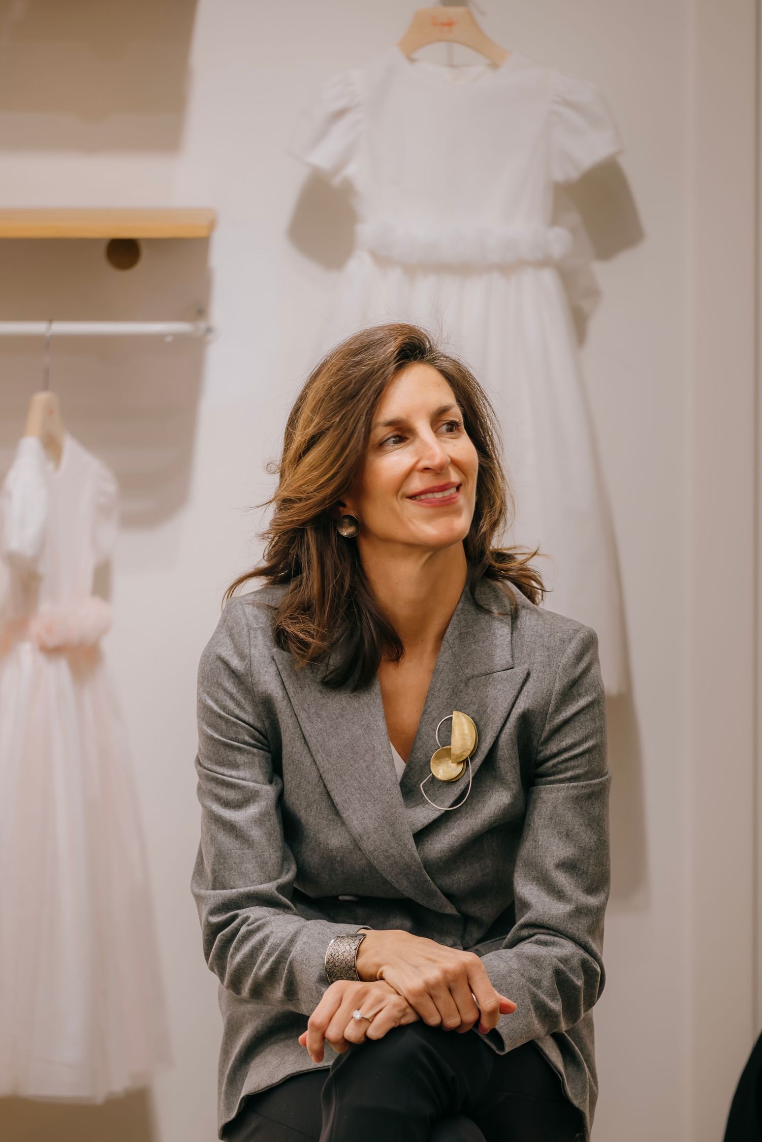 Candid event portrait in Paris boutique, storytelling editorial moment with natural light and cinematic tone